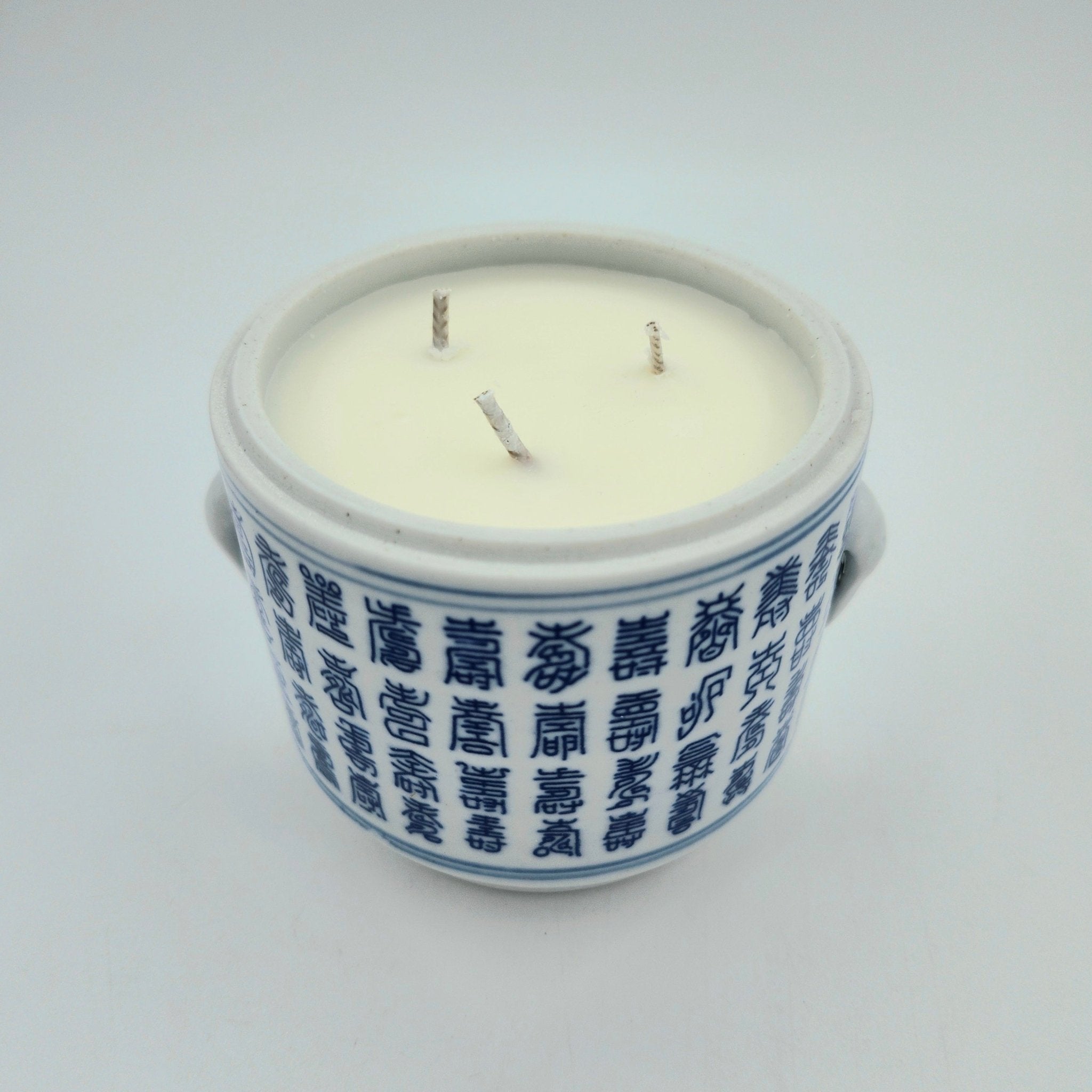 Tradition candle, blue and white lidded pot, detail
