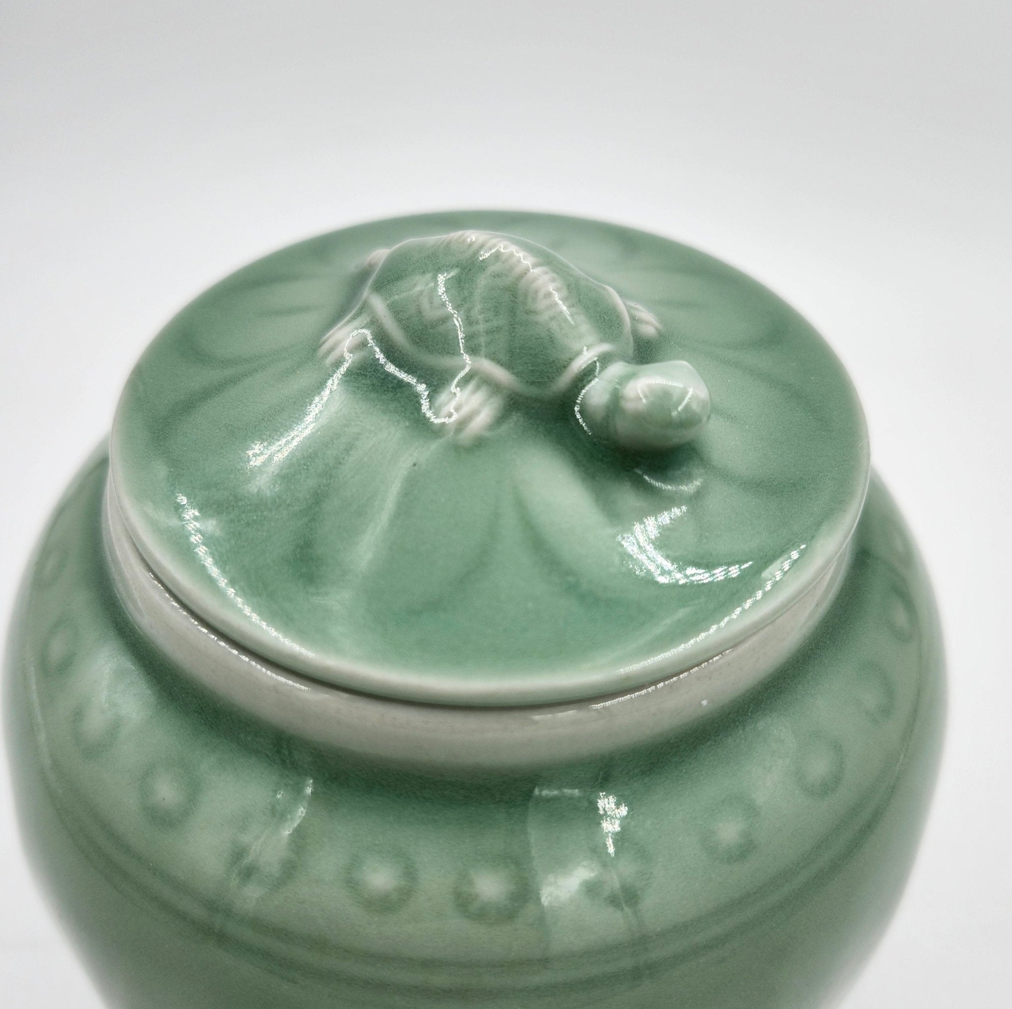 Wisdom candle, vintage celadon pot, styled view