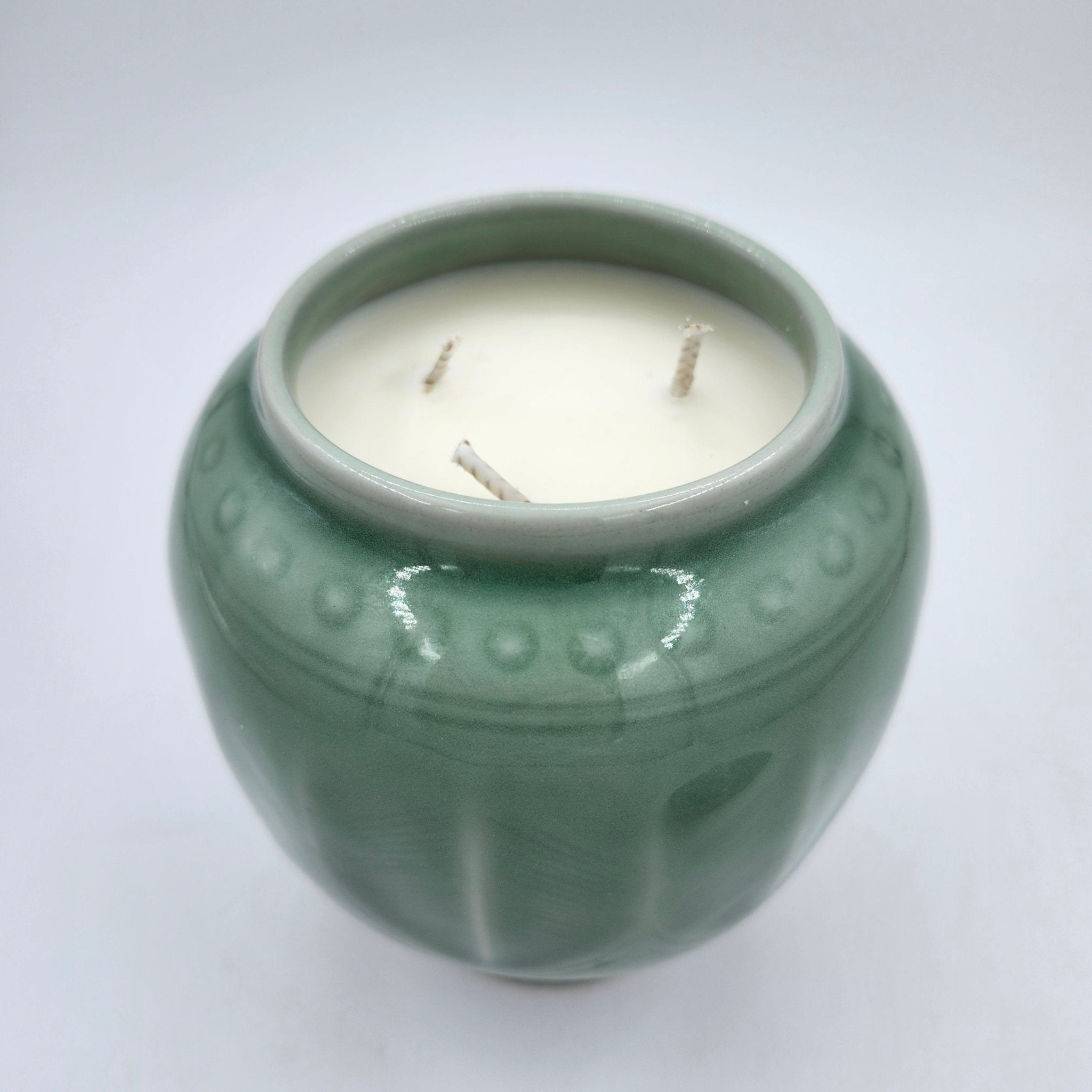 Wisdom candle, celadon pot with tortoise knob, detail