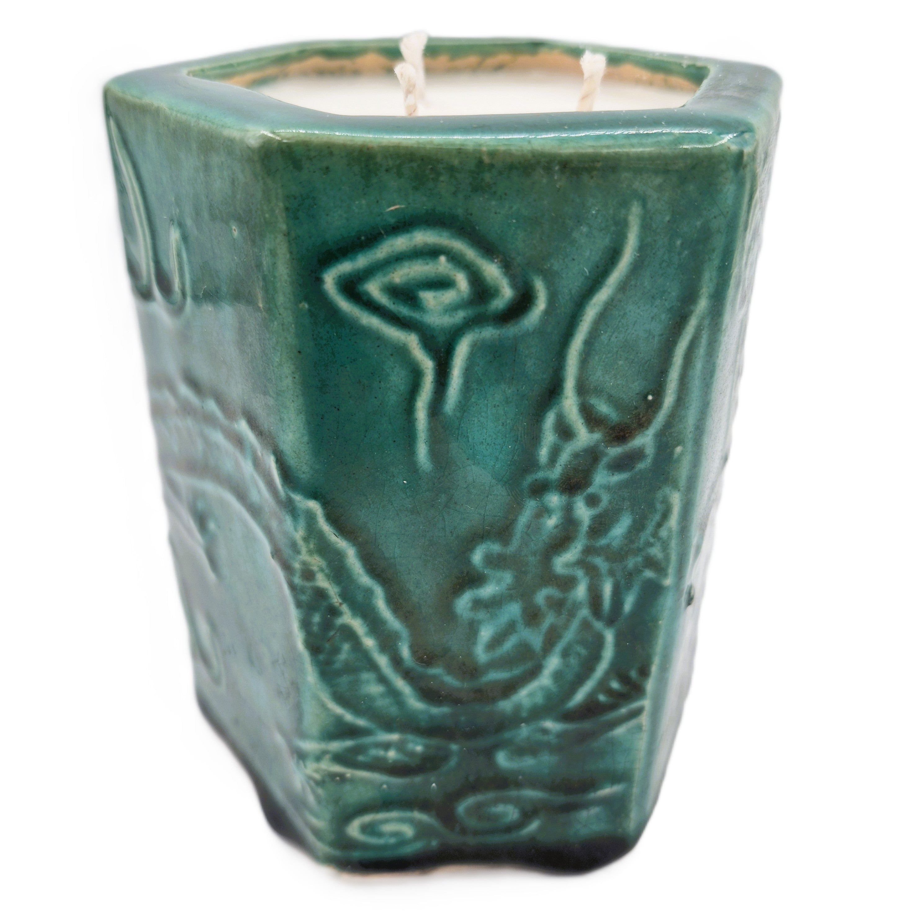 Emerald Dragon candle, dragon-motif hexagonal pot, styled view