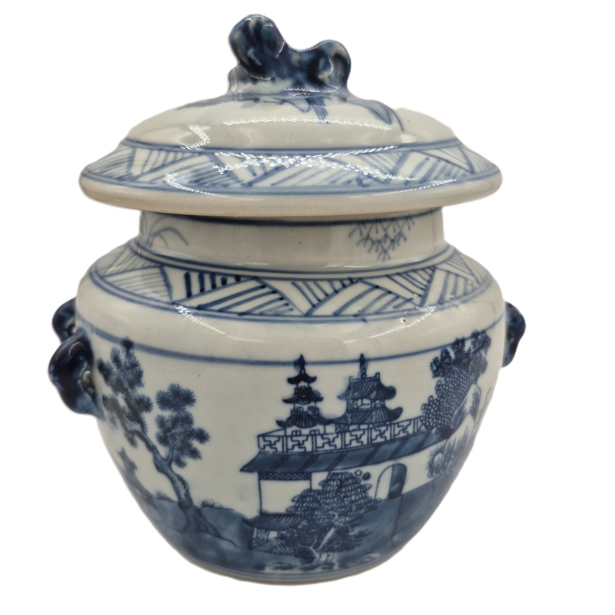 Scented Candle in a blue and white ceramic jar with lid on a white background