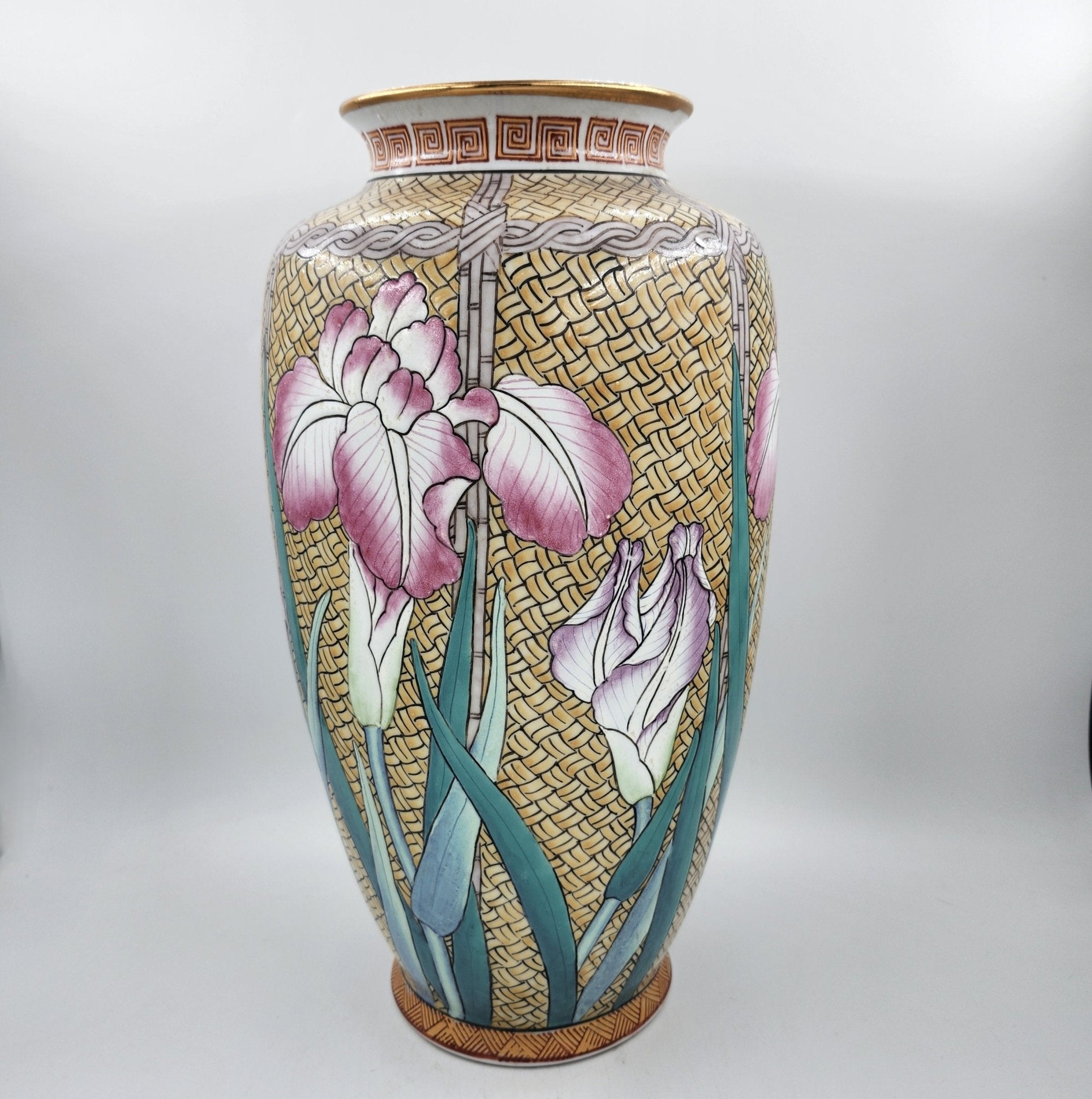 Famille Rose vase with pink and mauve iris on wicker, gold-edged, 35.5cm high