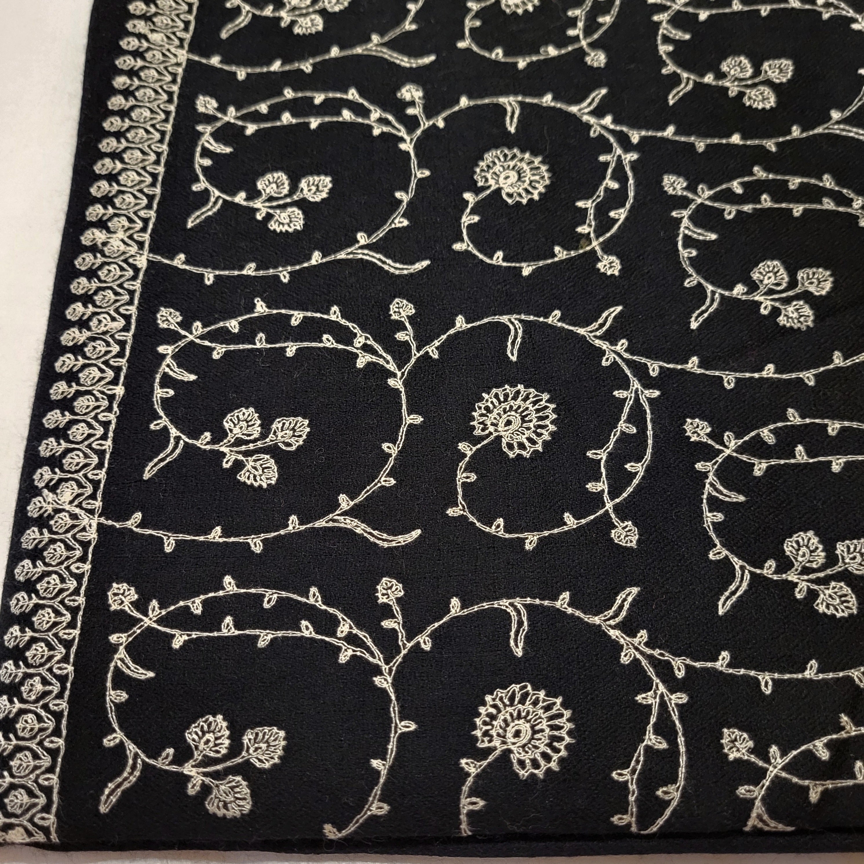 White floral embroidery on black pashmina, 100% pashmina, detail view