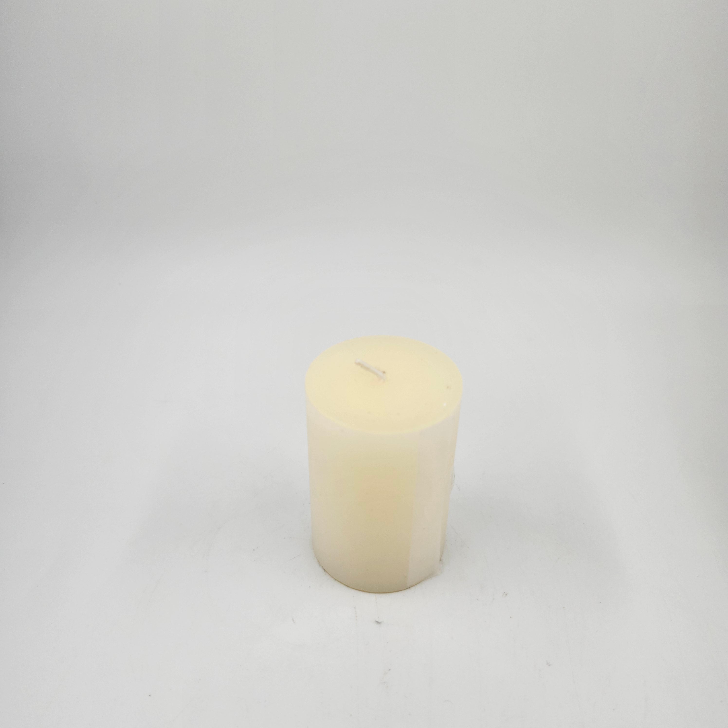 Off white pillar candle 5 x 7.5cm