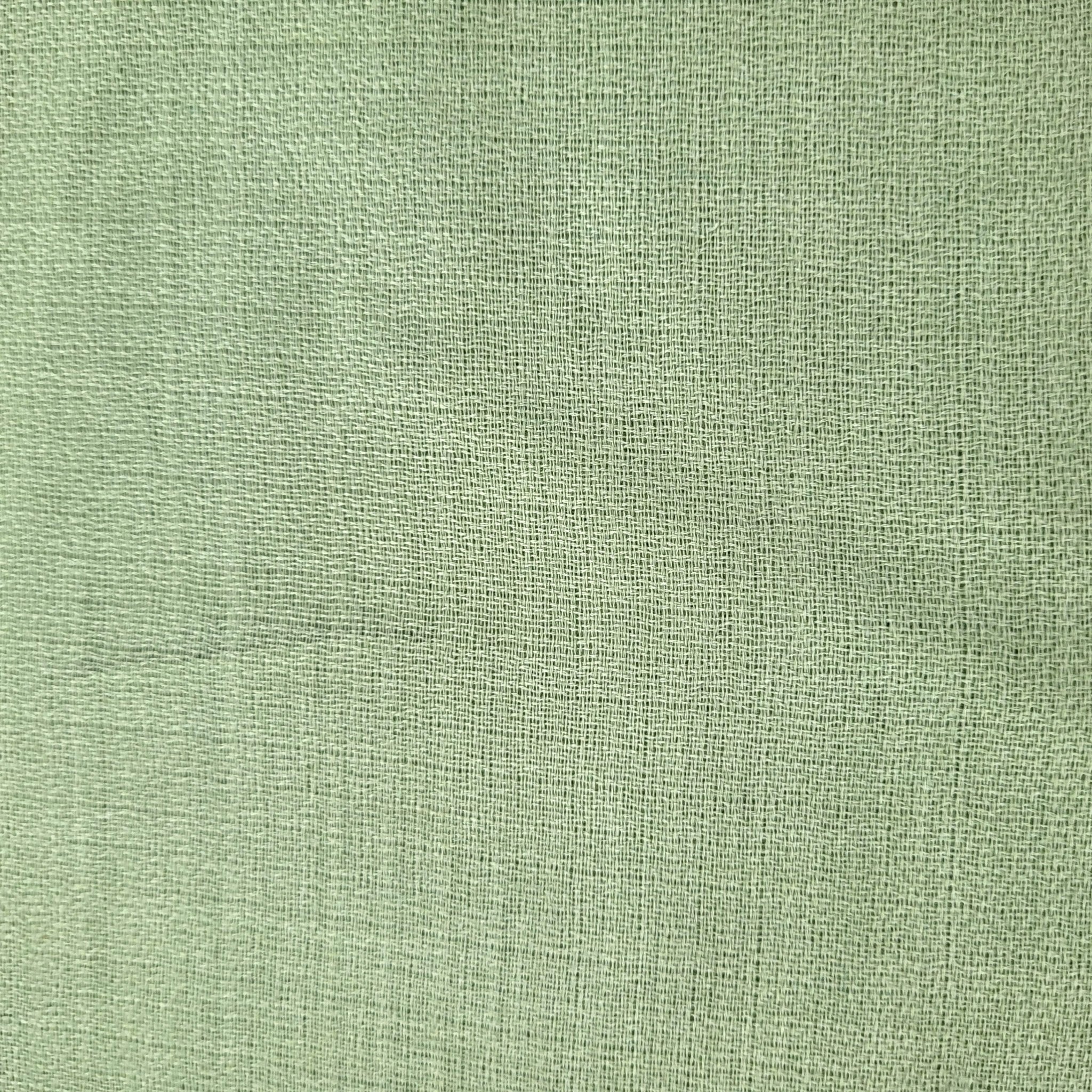 Plain 100% pashmina shawl in soft pistachio green, finely woven, lightweight to wear around the neck