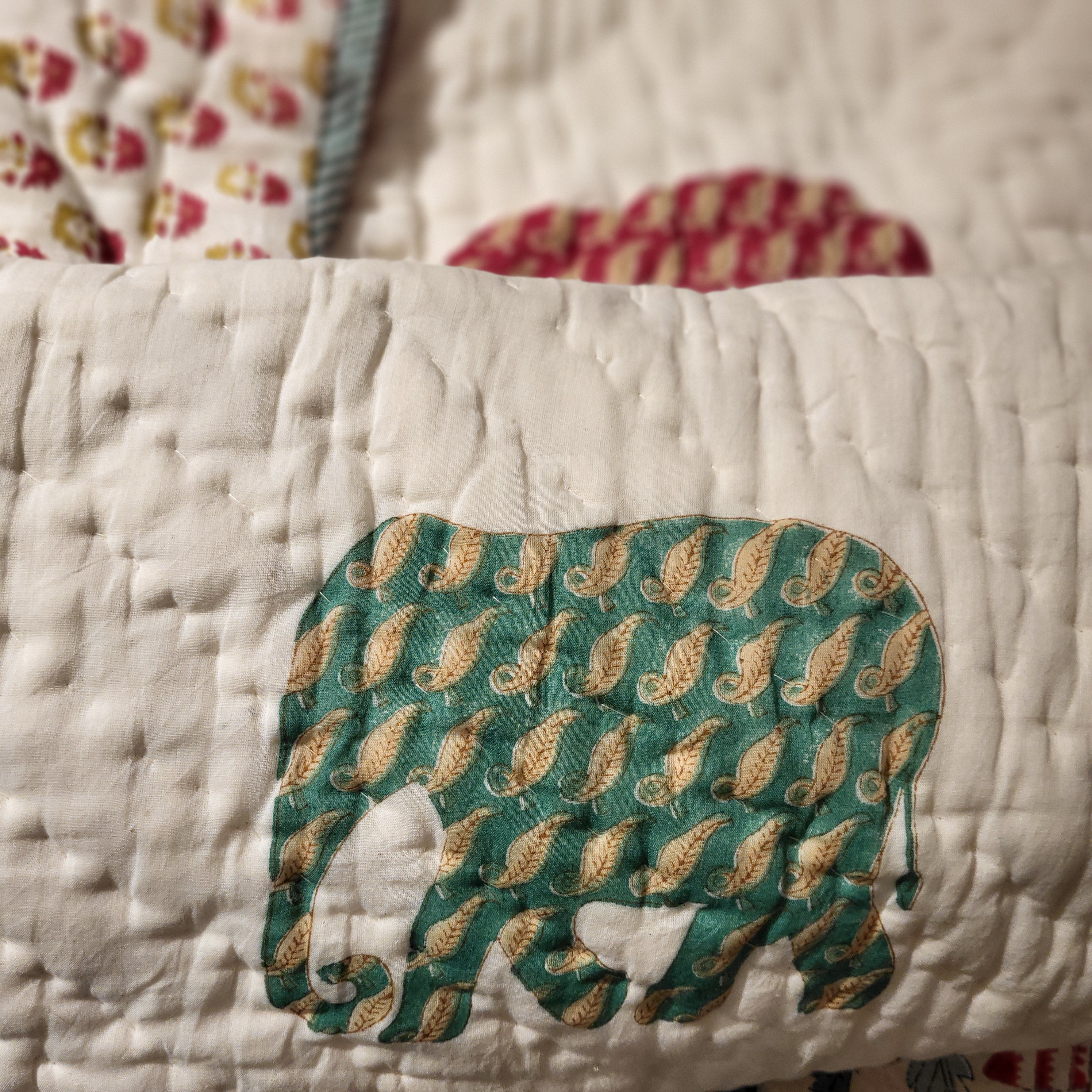 Block-print elephant quilt, floral side
