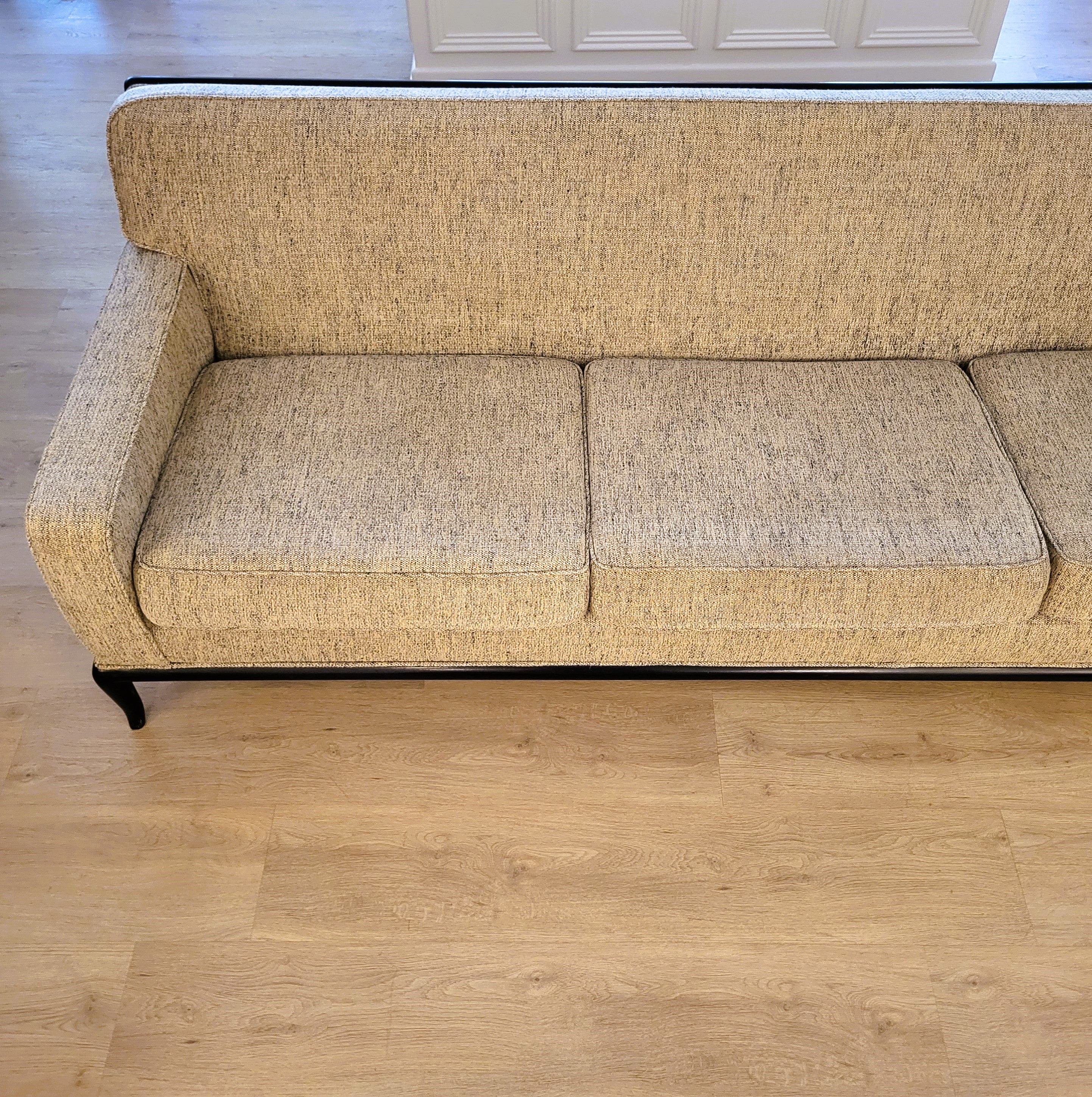 Robsjohn-Gibbings three-seater sofa, angled view