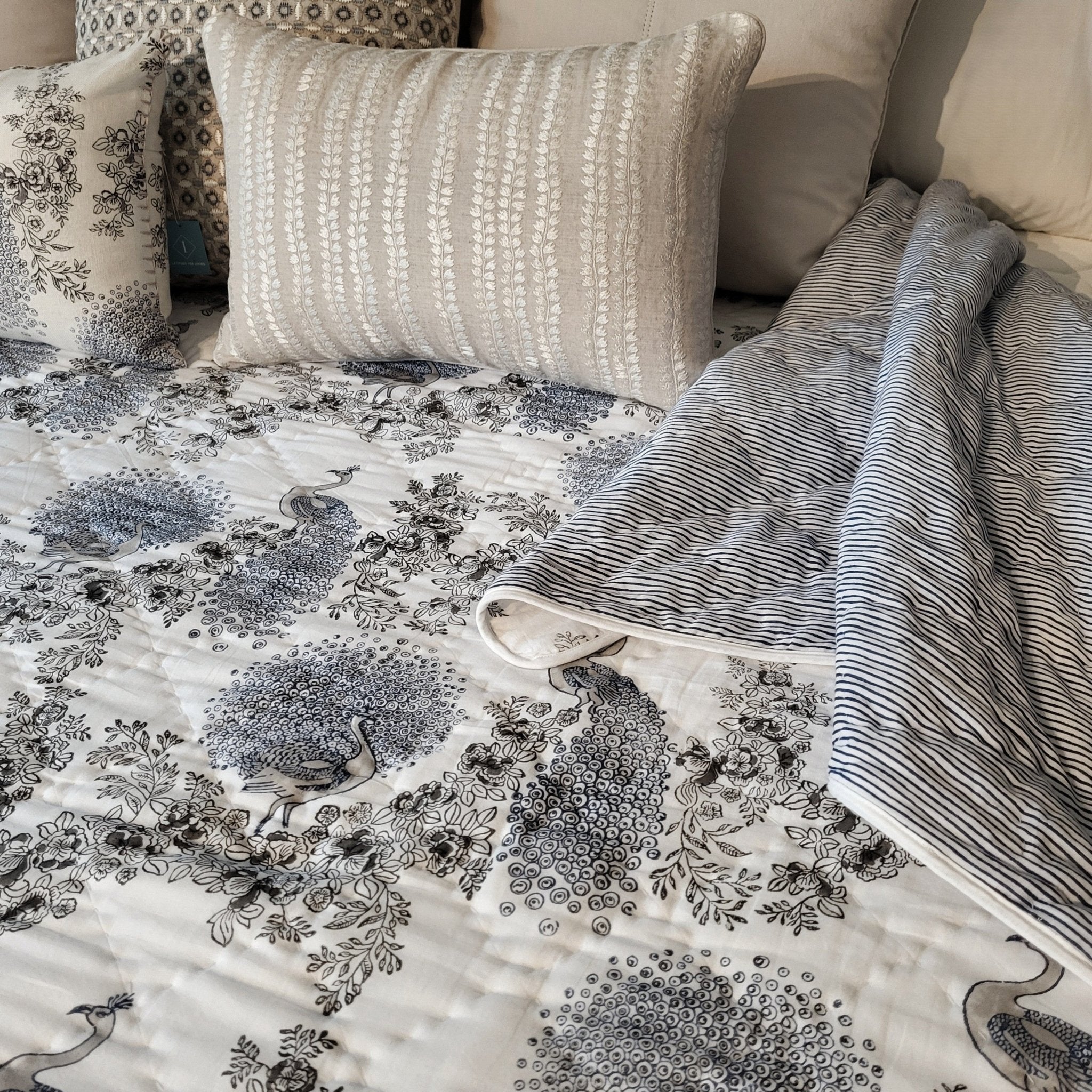 Samode Peacock hand-quilted Jaipur quilt in blue and white