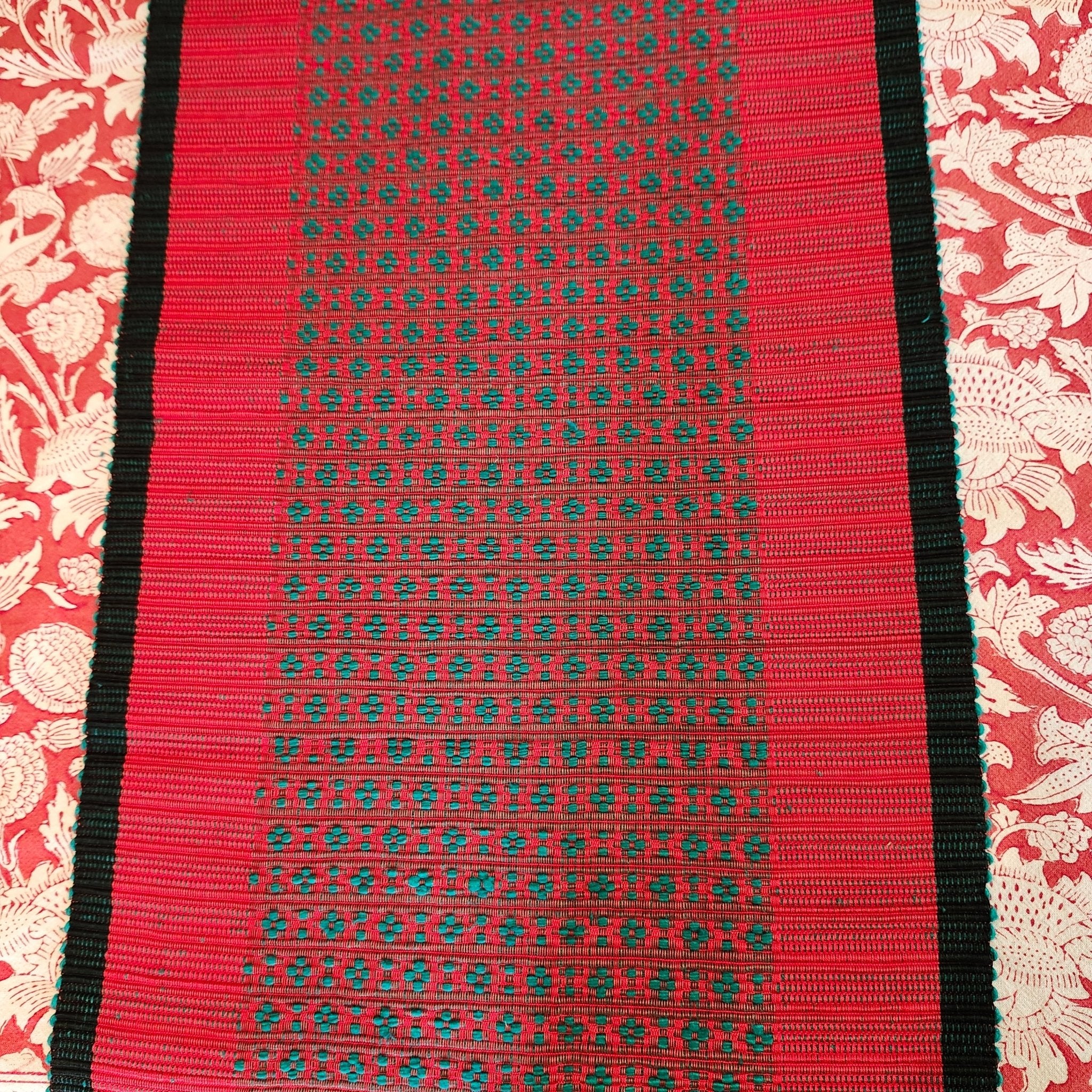 Handwoven festive table runner in red cotton, handloom woven