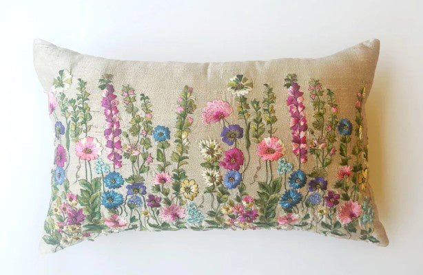 Cushion embroidered with wild flowers.