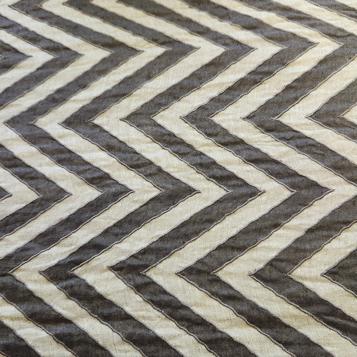 Chevron linen runner in plain and chocolate stripes, each end finished with hand-crafted multicoloured tassels