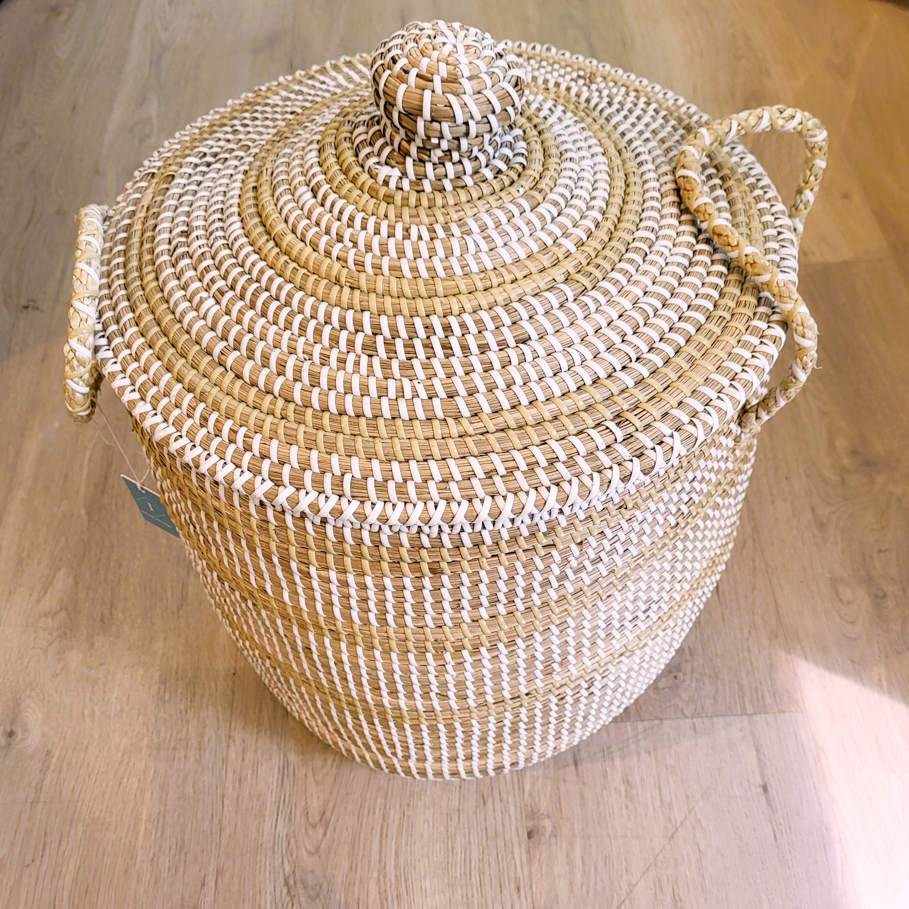 Small white seagrass laundry basket with lid, handwoven