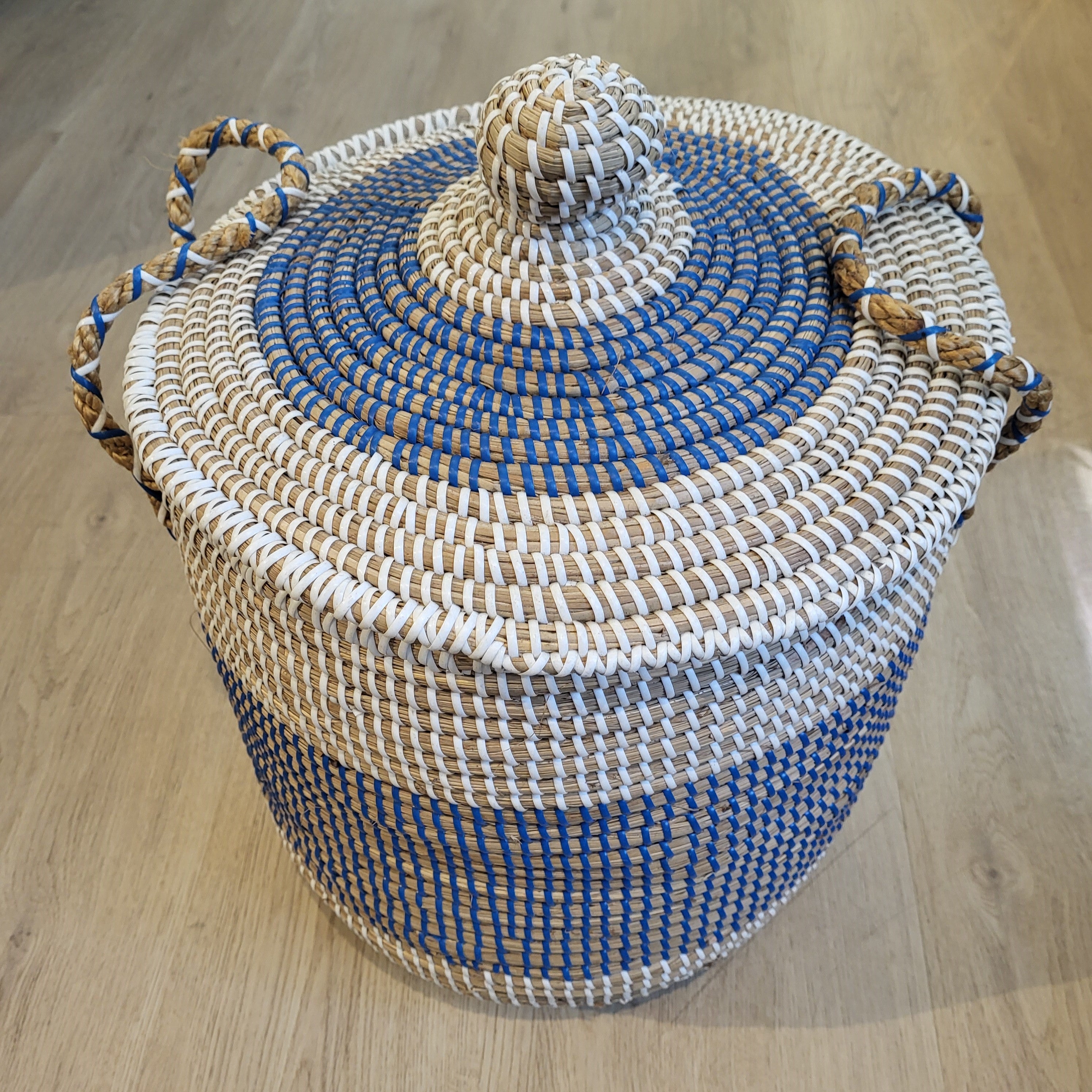 Small blue seagrass laundry basket with lid, handwoven