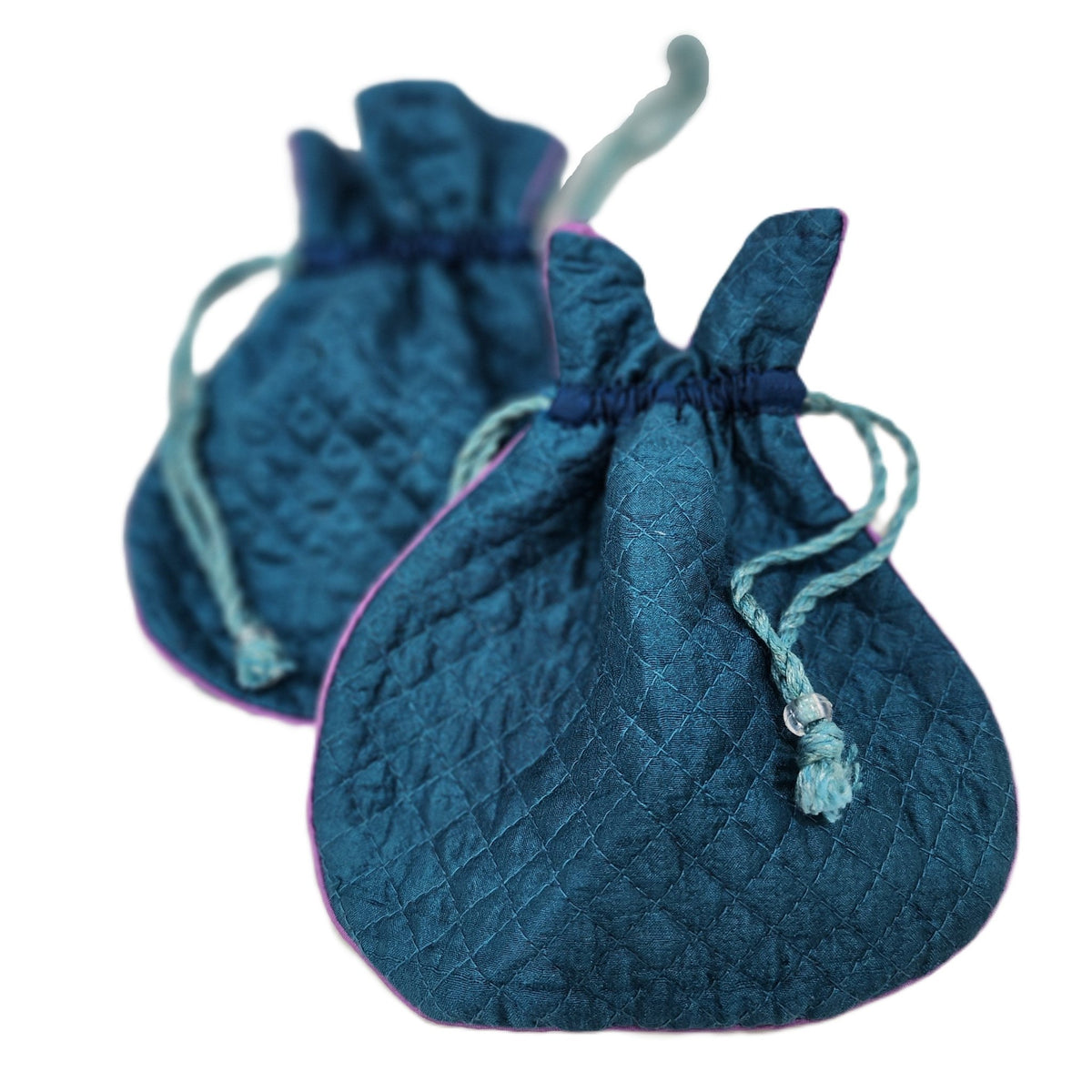 Peacock blue quilted silk pouch, 16.5 by 18cm, lined in pink silk, for jewellery or small accessories.