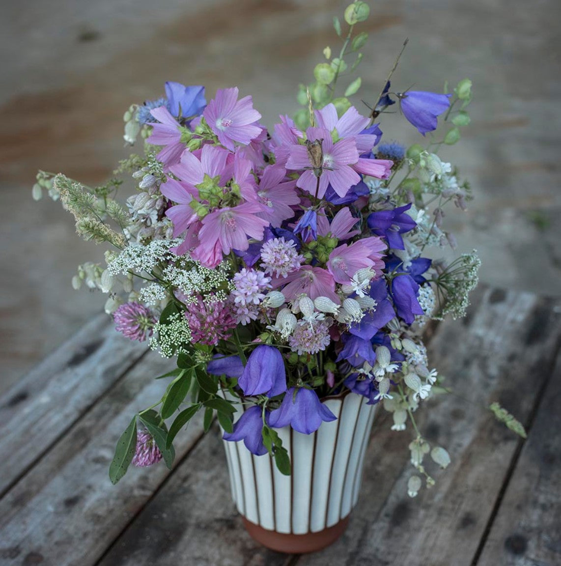 Putty Salon high ribbed vase, fluted terracotta, styled with flowers