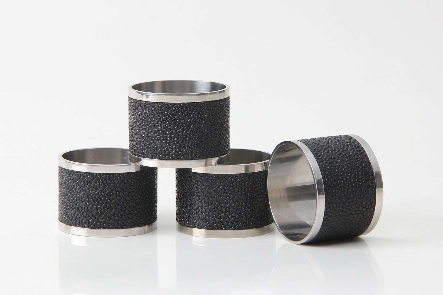 Caviar black faux shagreen napkin rings by Forwood Design, set of 4, styled on a dinner table