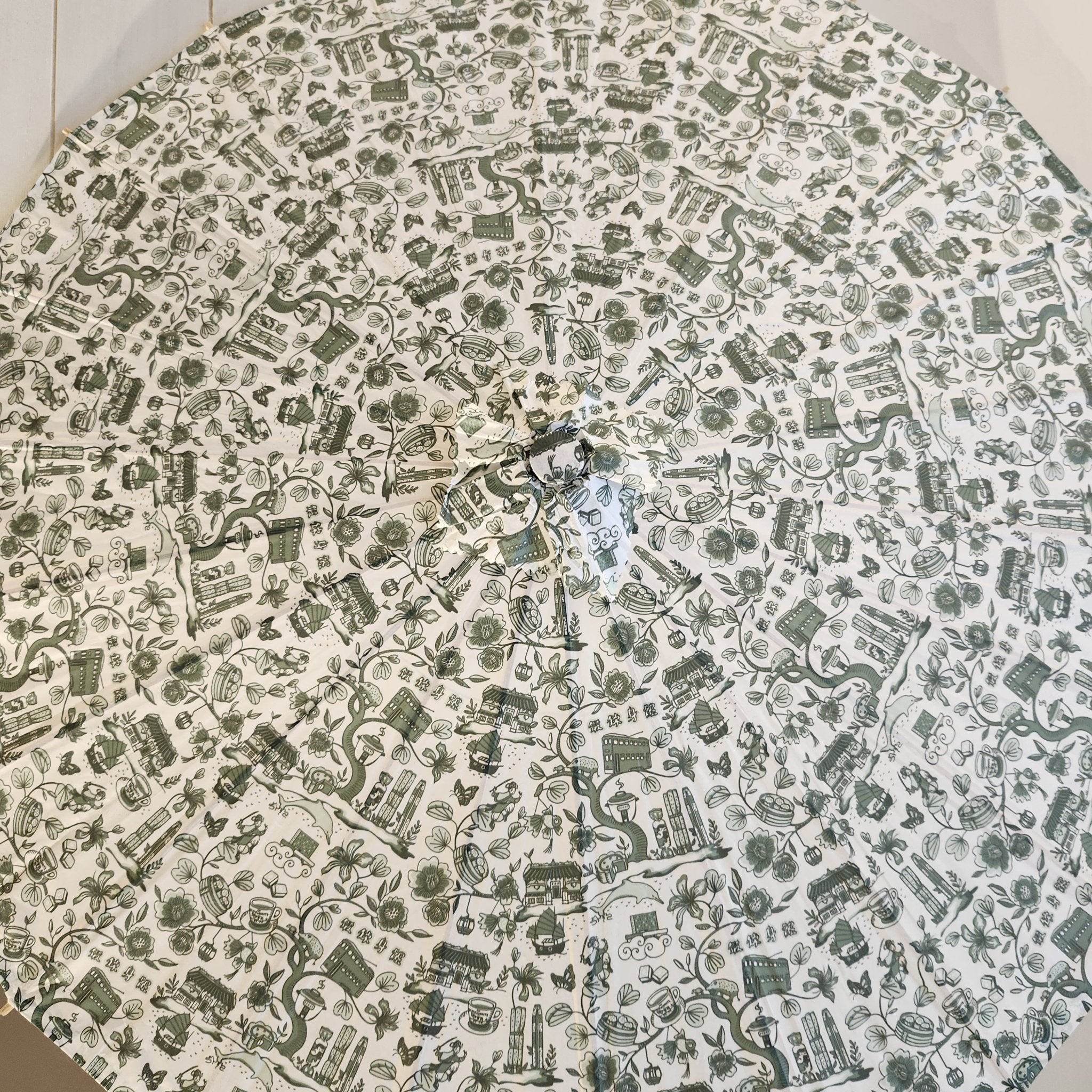 Hong Kong Toile paper parasol in green and white, printed paper on wooden frame