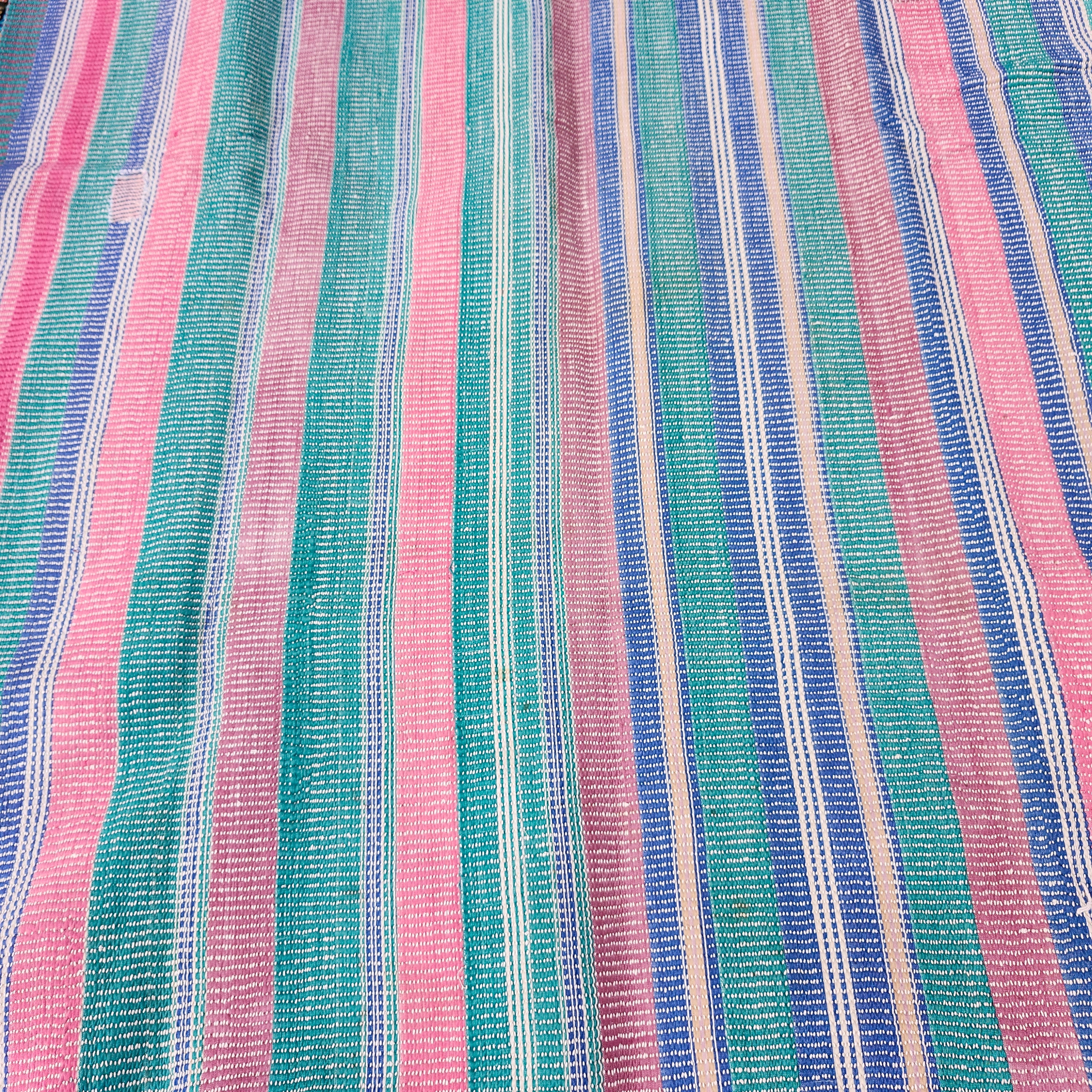 Faded pastel striped kantha quilt, folded