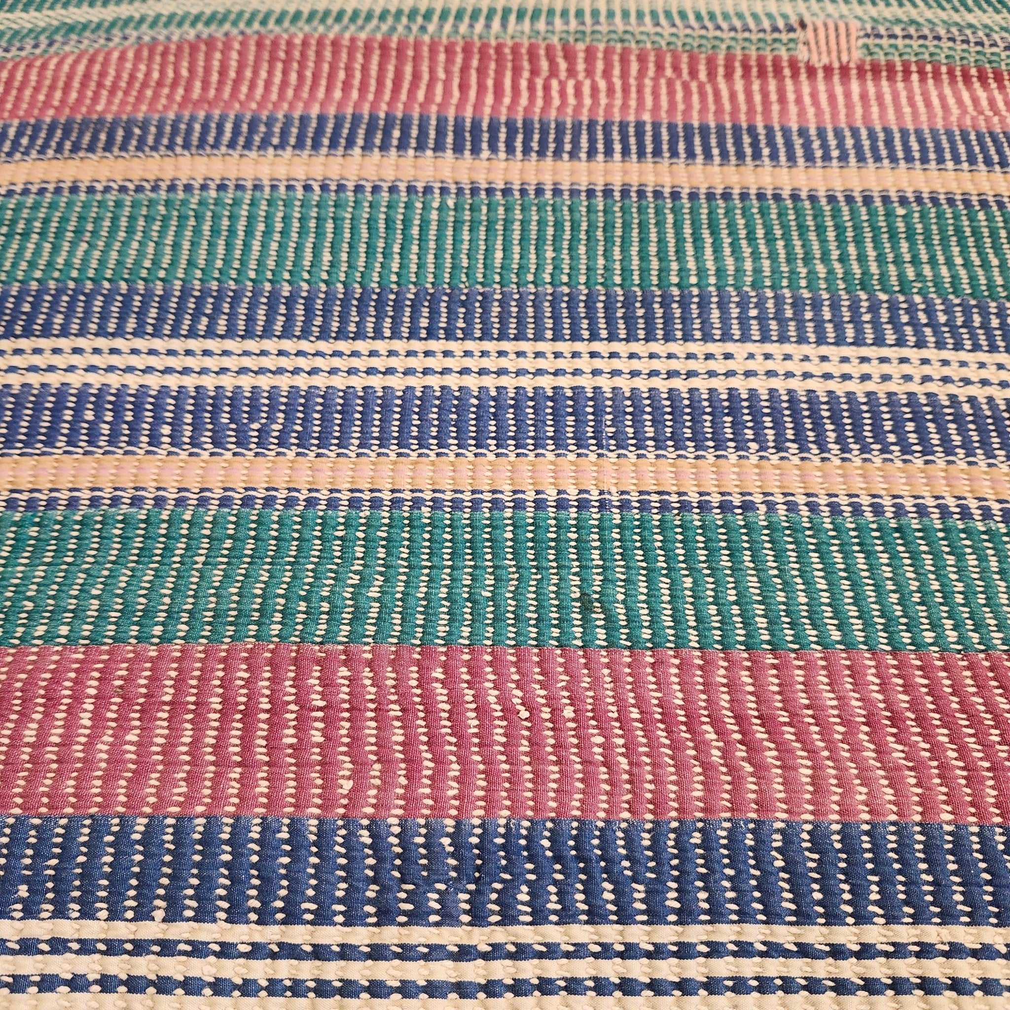 Pastel striped vintage kantha quilt, reverse side