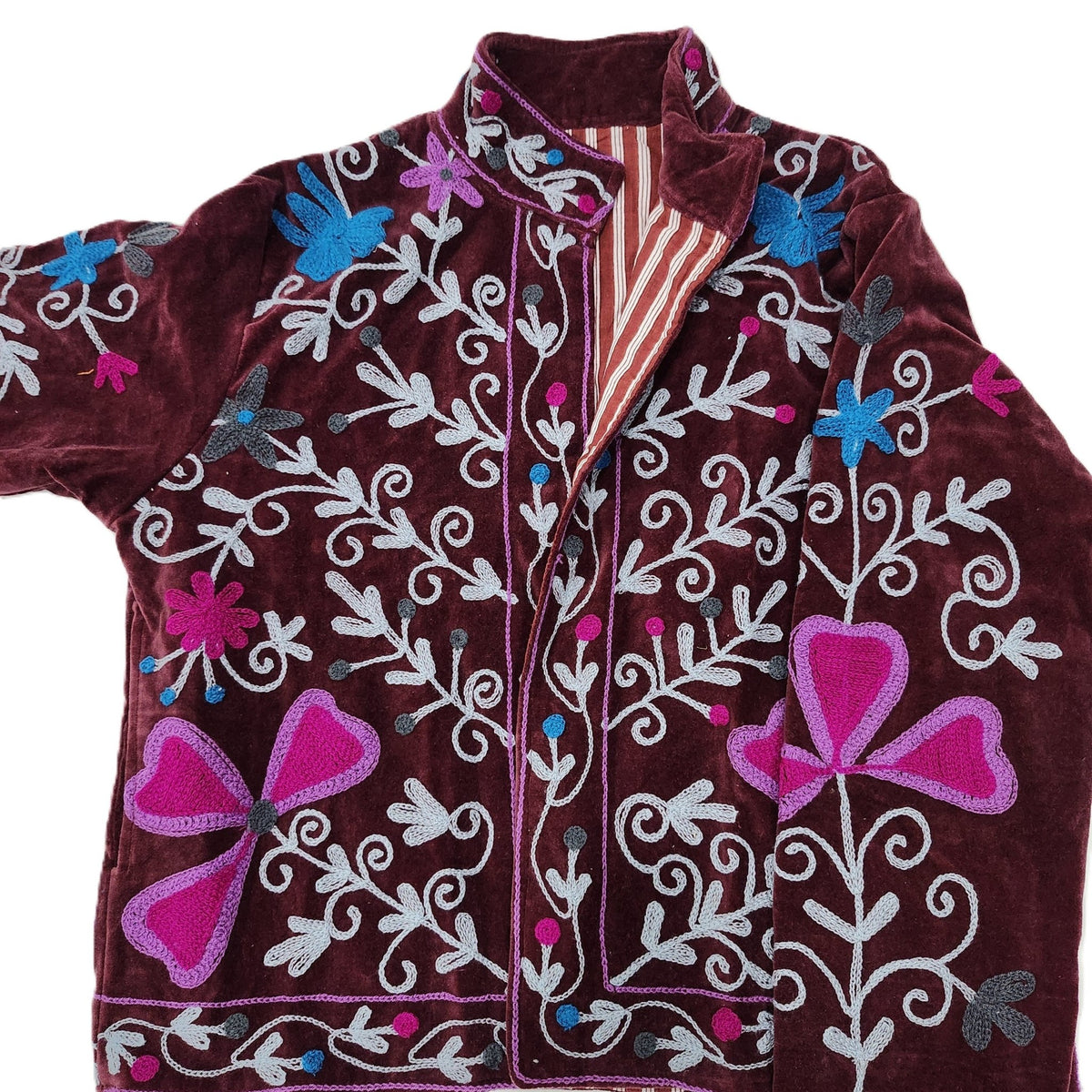 Burgundy velvet jacket with hand worked suzani stitching, lined in a complementary red stripe block print.