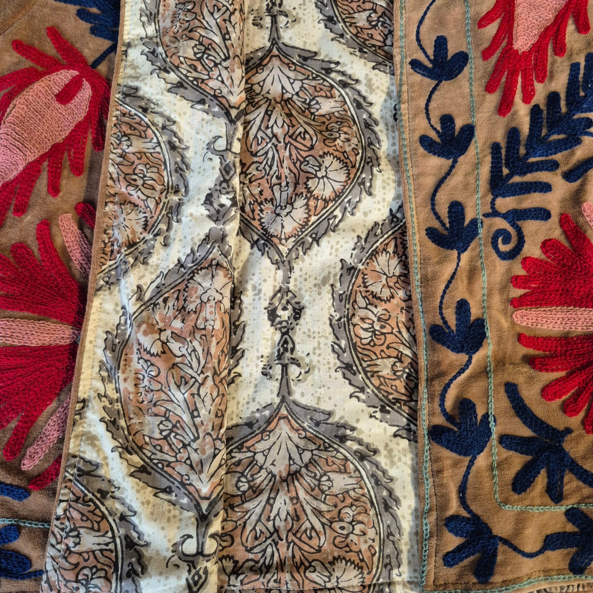Bronze suzani velvet jacket, rolled sleeves showing lining