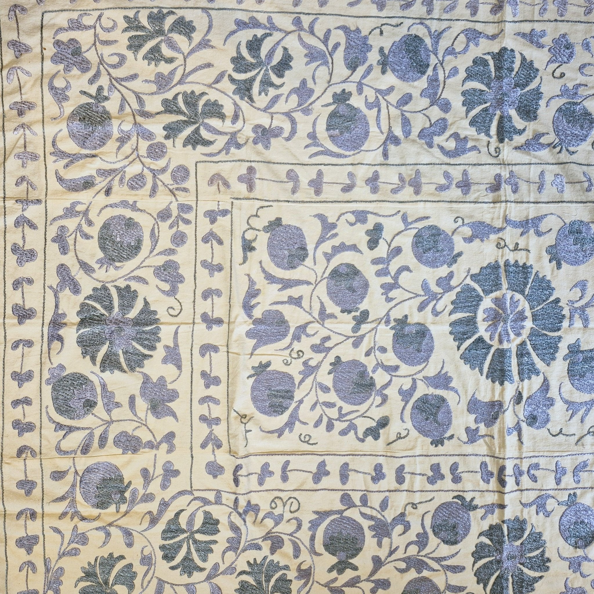 Vintage suzani fabric in petrol and grey, hand stitched silk embroidery on a cotton base, detail view