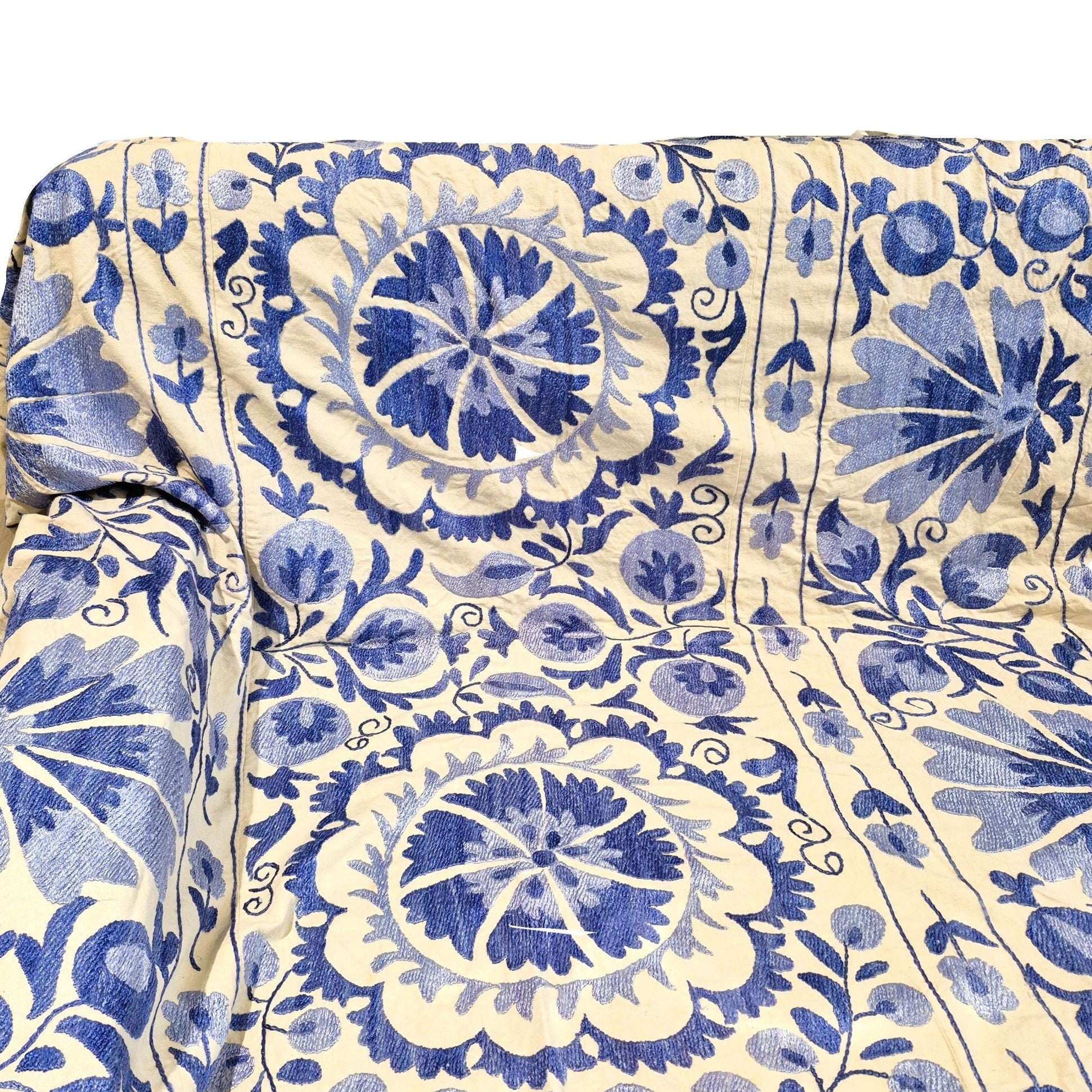 Royal blue embroidered suzani fabric with flowers and mandalas