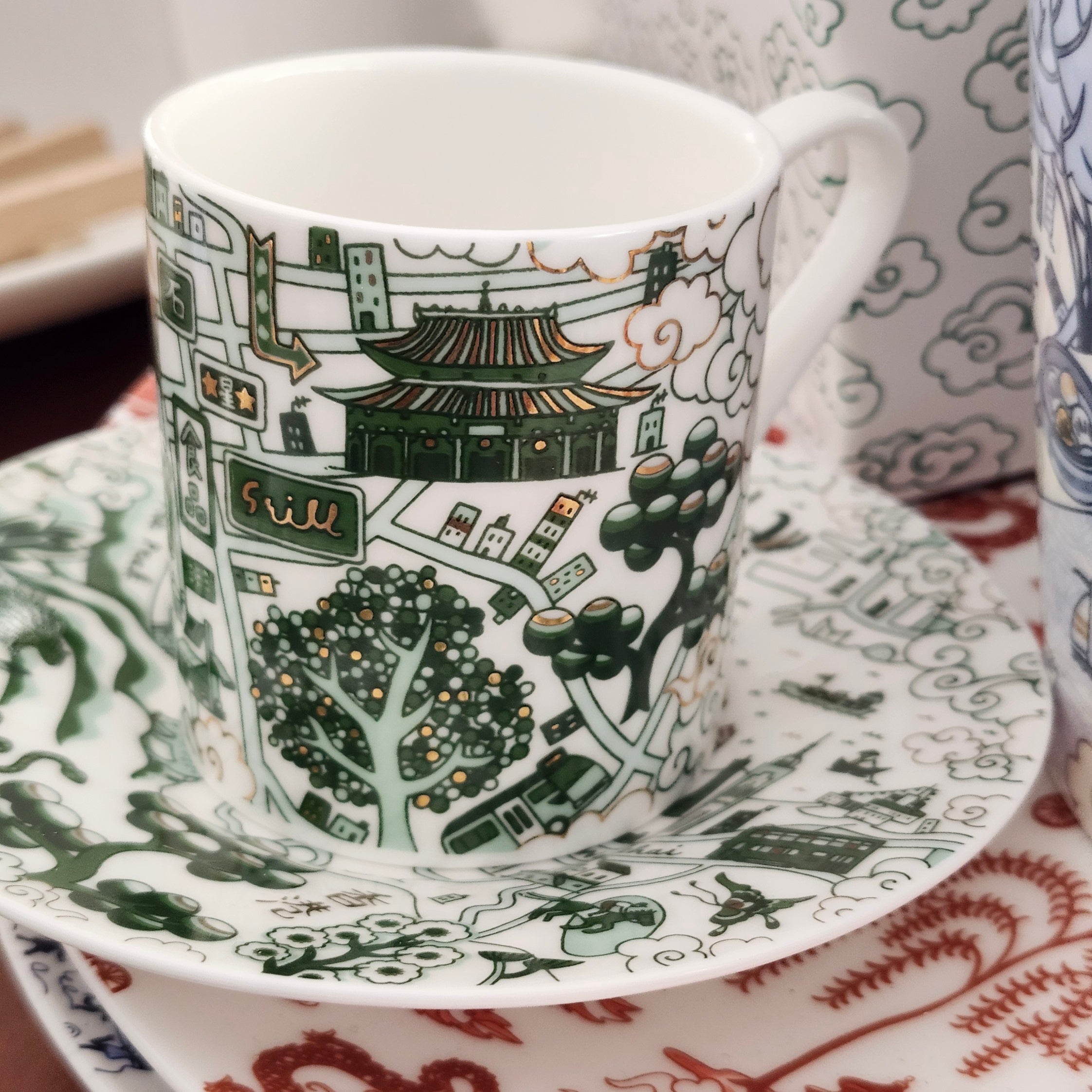 Willow pattern espresso cups and saucers in green and gold, set of two, ceramic