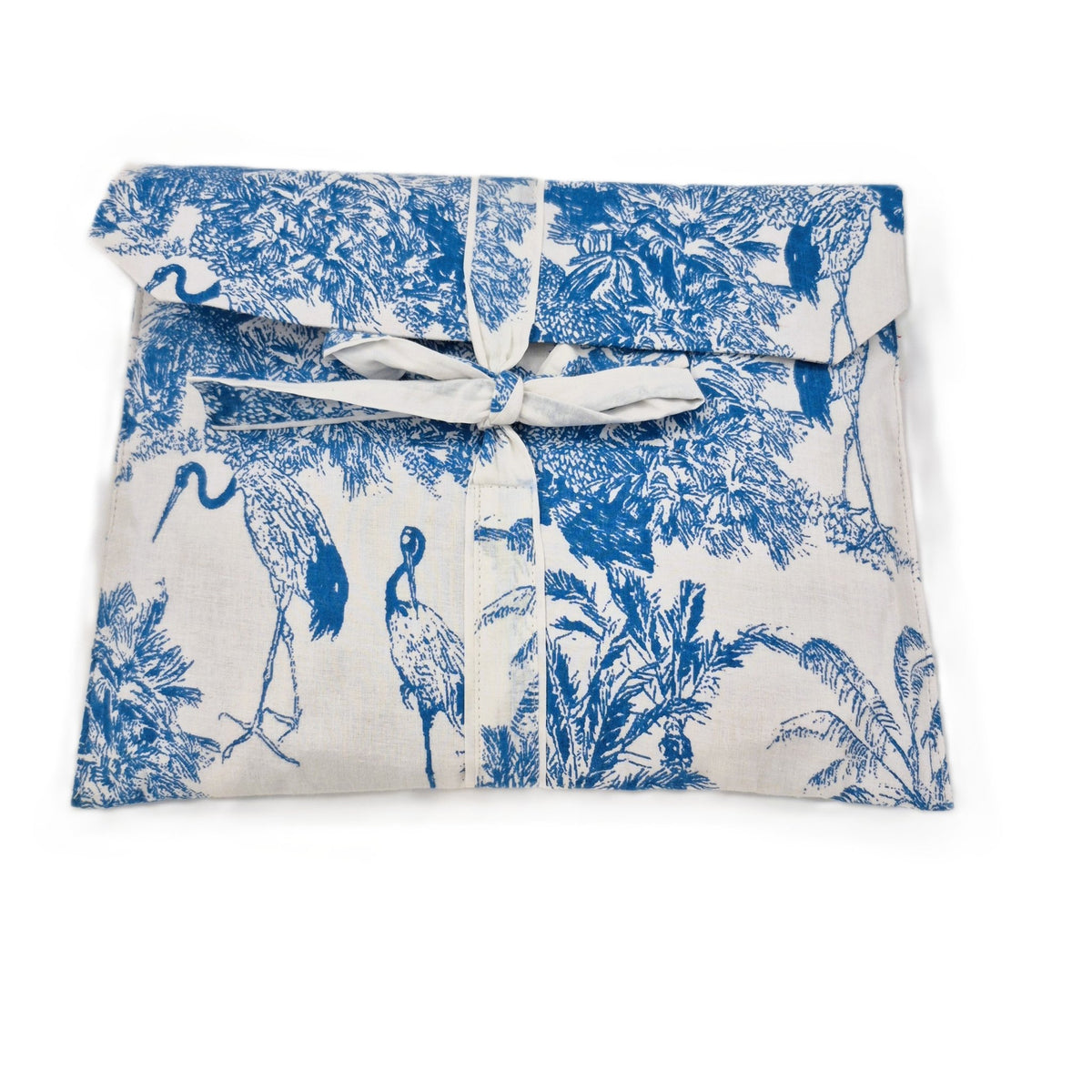 Bird and animal block print cotton cambric pyjamas, long sleeved with a pocket and contrast trim.
