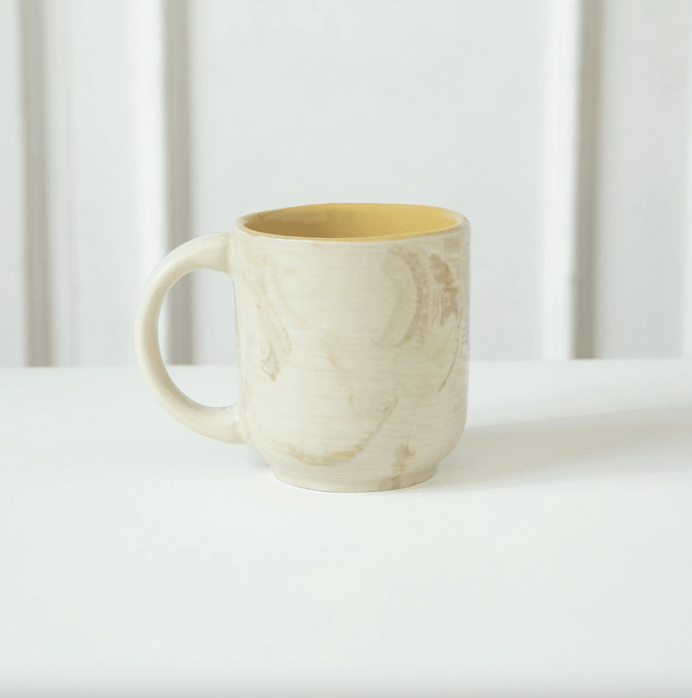 Handmade Amber Love ceramic mug with beige exterior and mustard interior, 200 ml