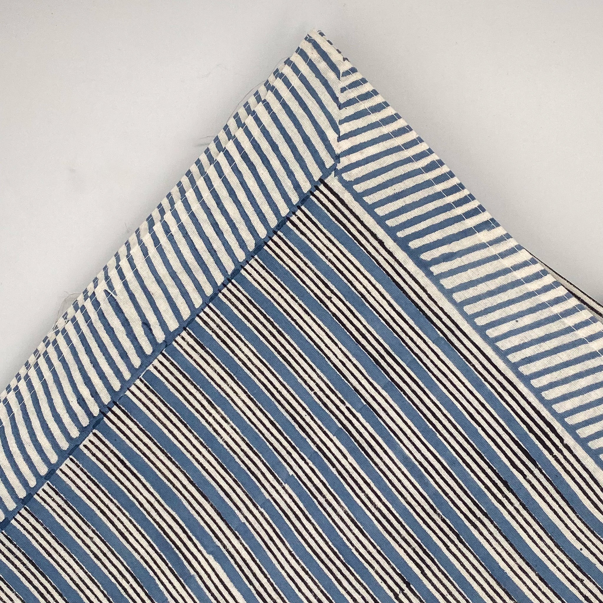 Block-print striped cotton tablecloth with a diagonal stripe border