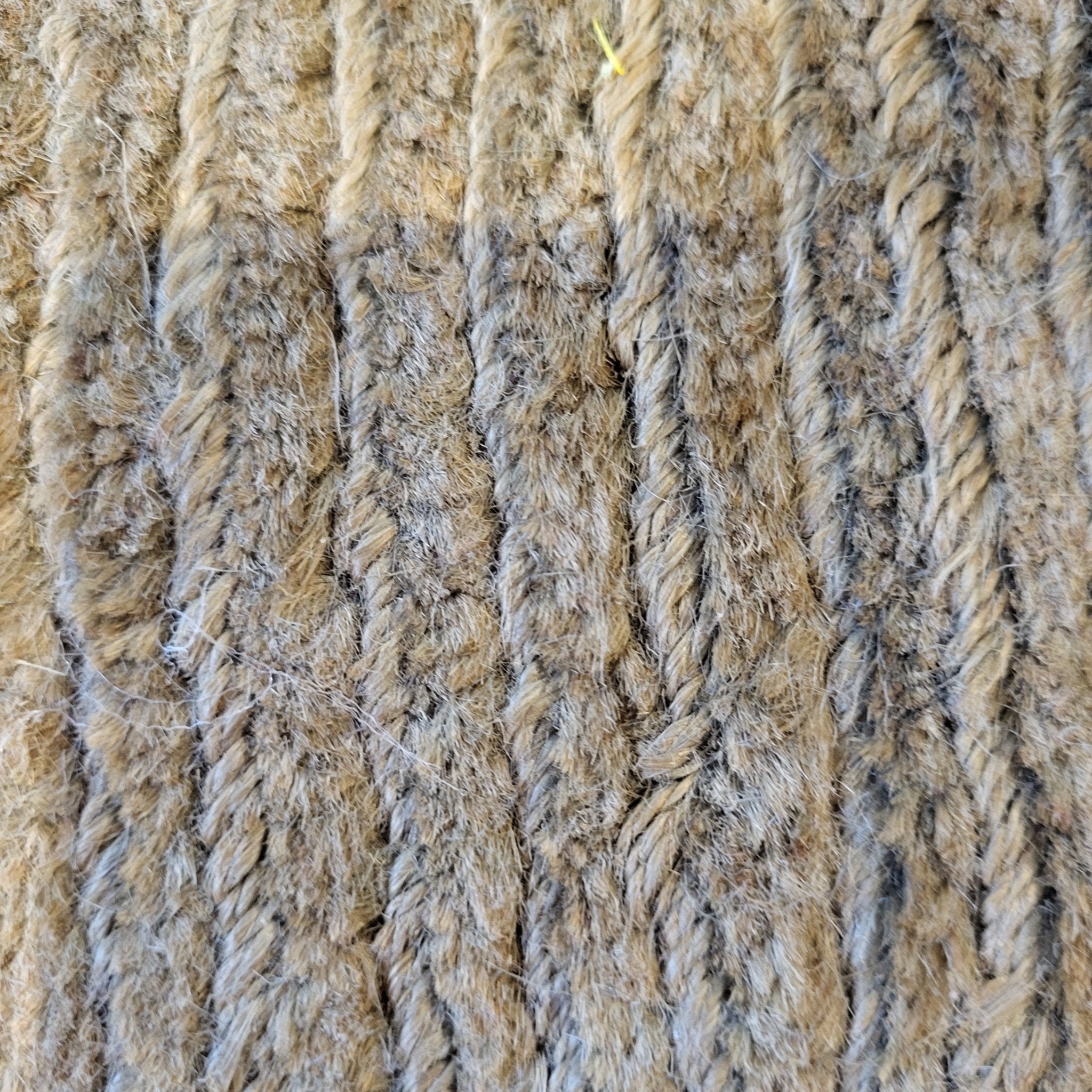 Jute rug in deep olive, woven tufts and loops with a subtle stripe, natural fibre