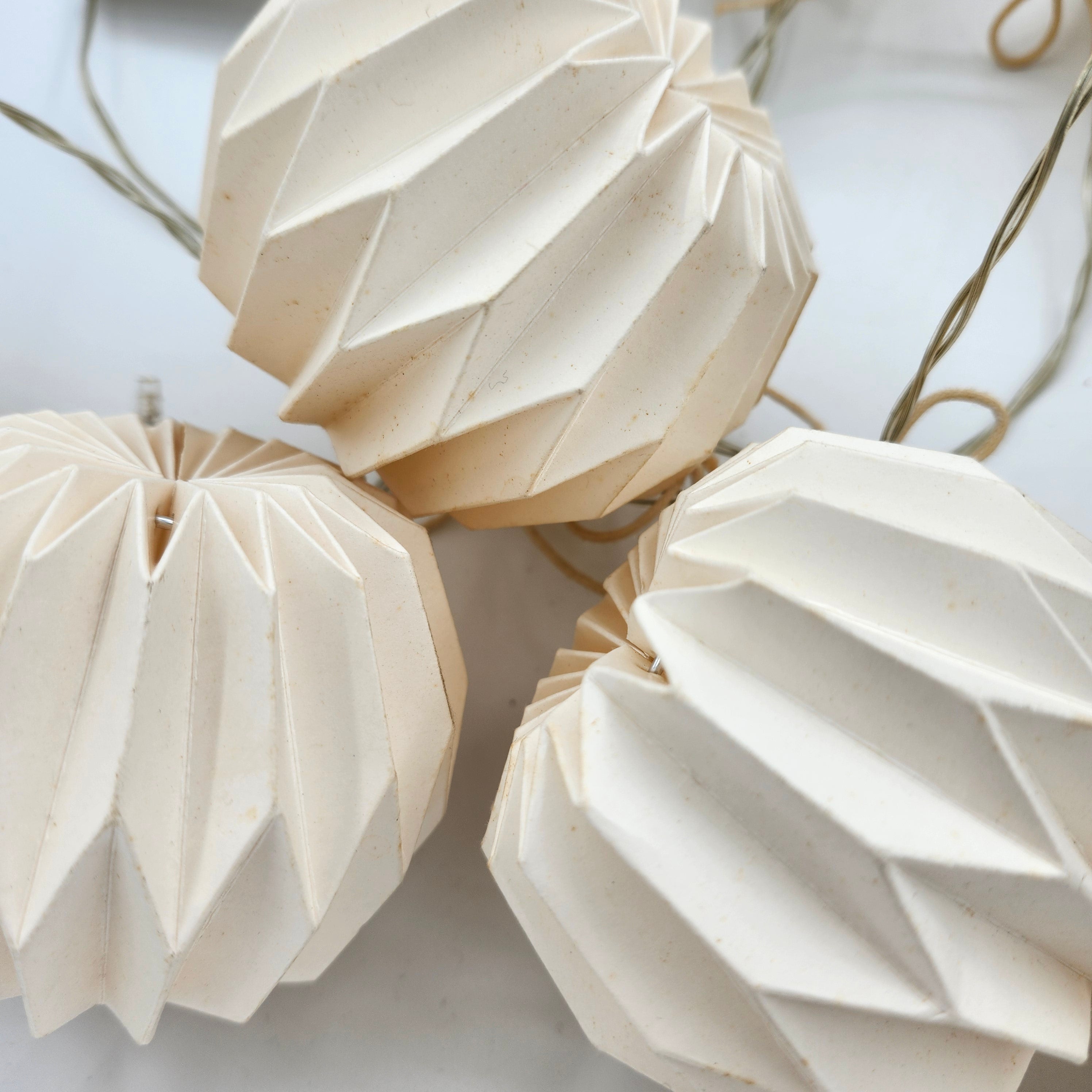 Origami paper bauble garland with LED lights, styled, detail view