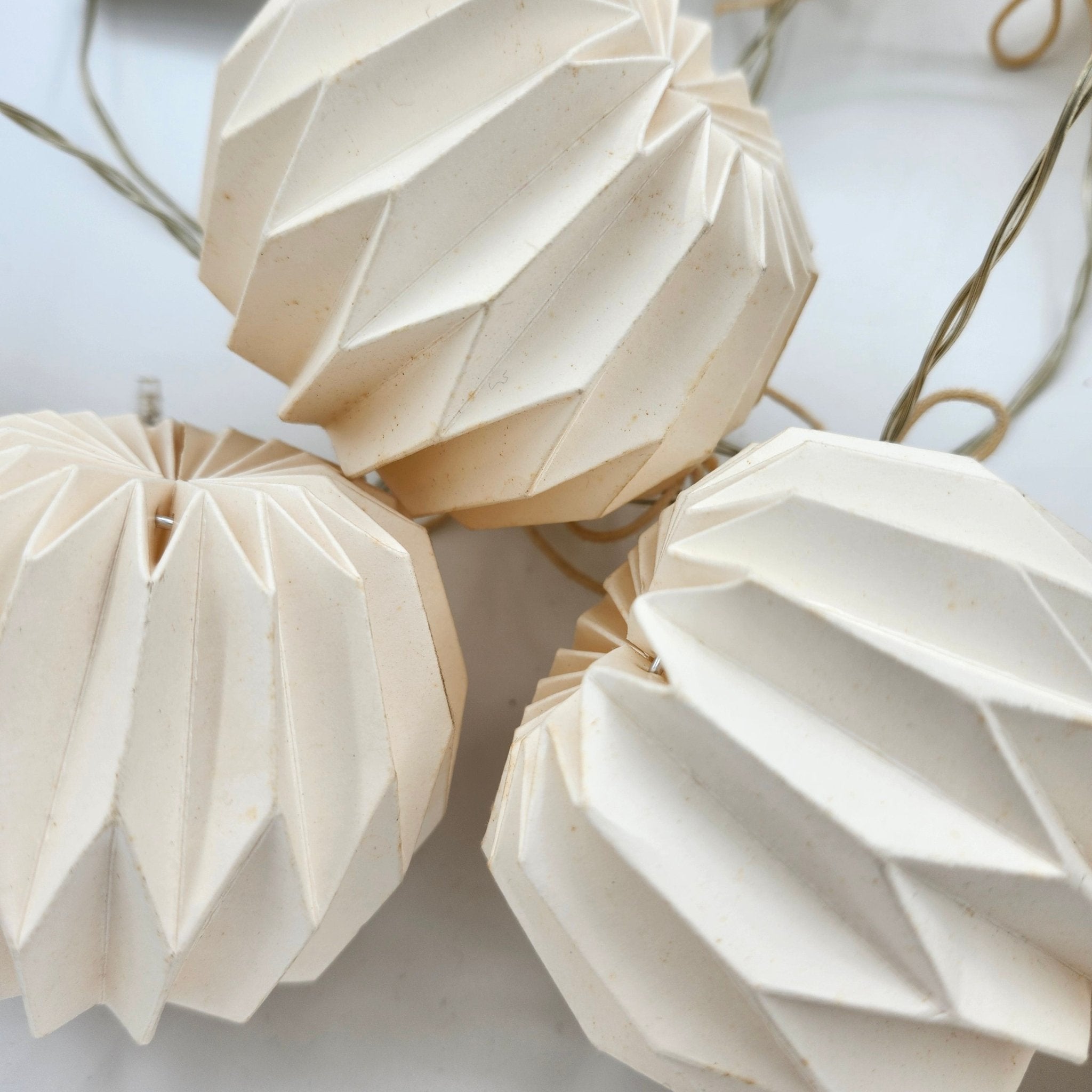 Origami paper bauble garland with LED lights, styled, detail view