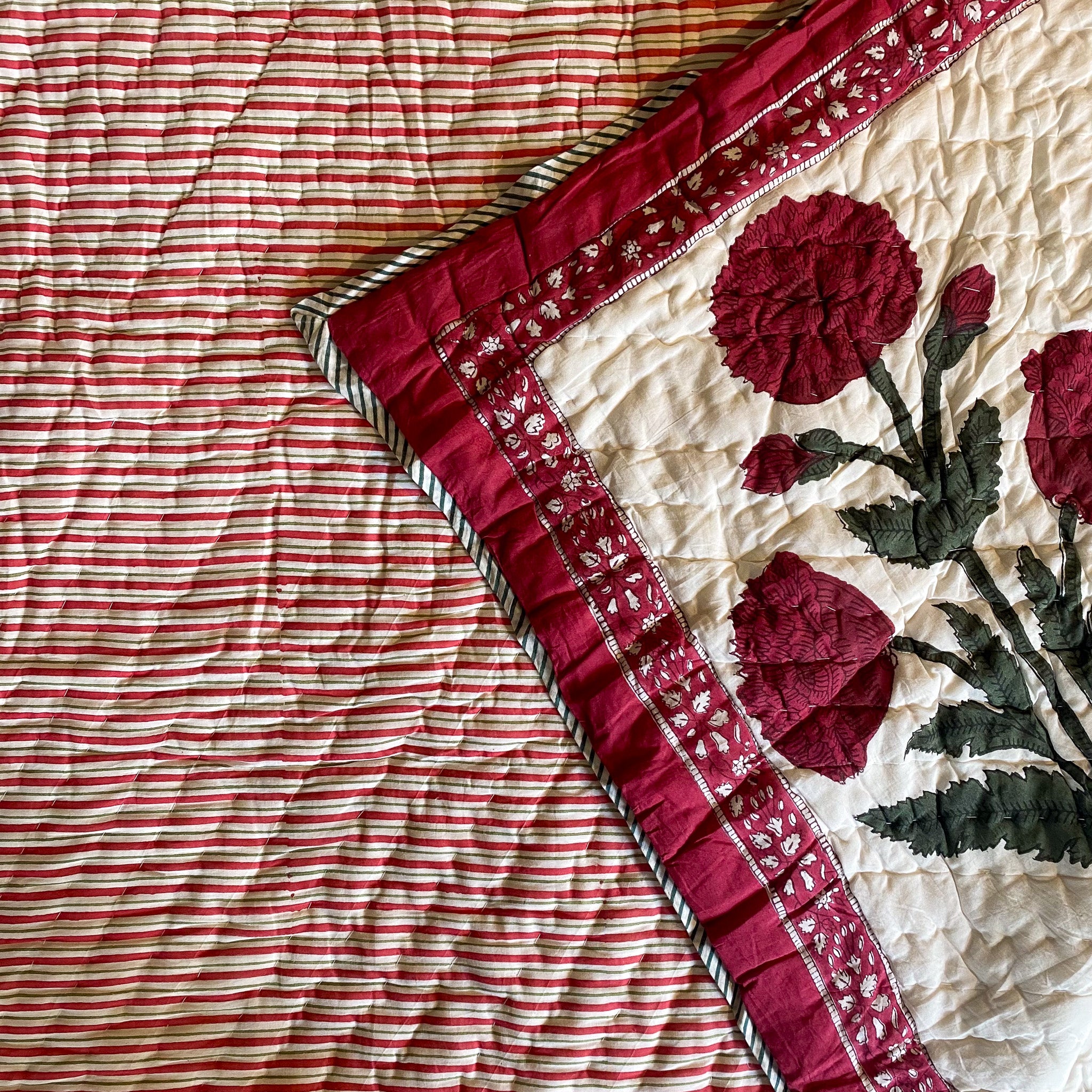 Queen block-print quilt with a red poppy pattern