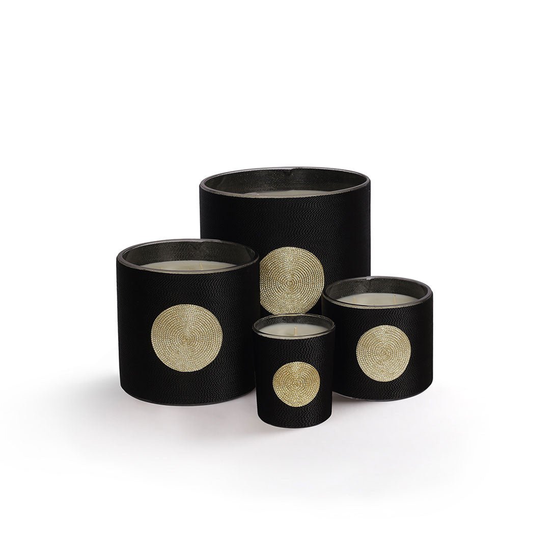 Sabra Dana Oud candle, black silk-wrapped jar, styled view