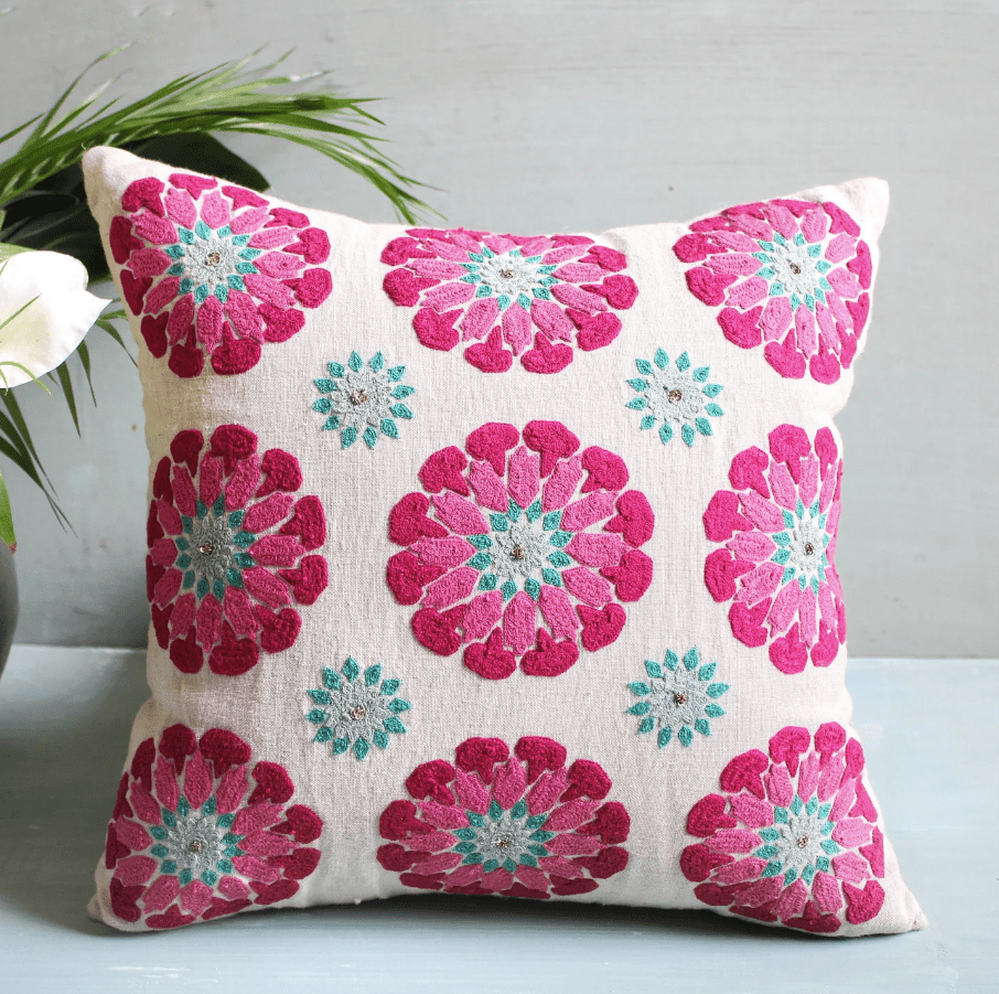 Suzani Butah Motif linen cushion, hand embroidered in pink and turquoise, 45 x 45cm