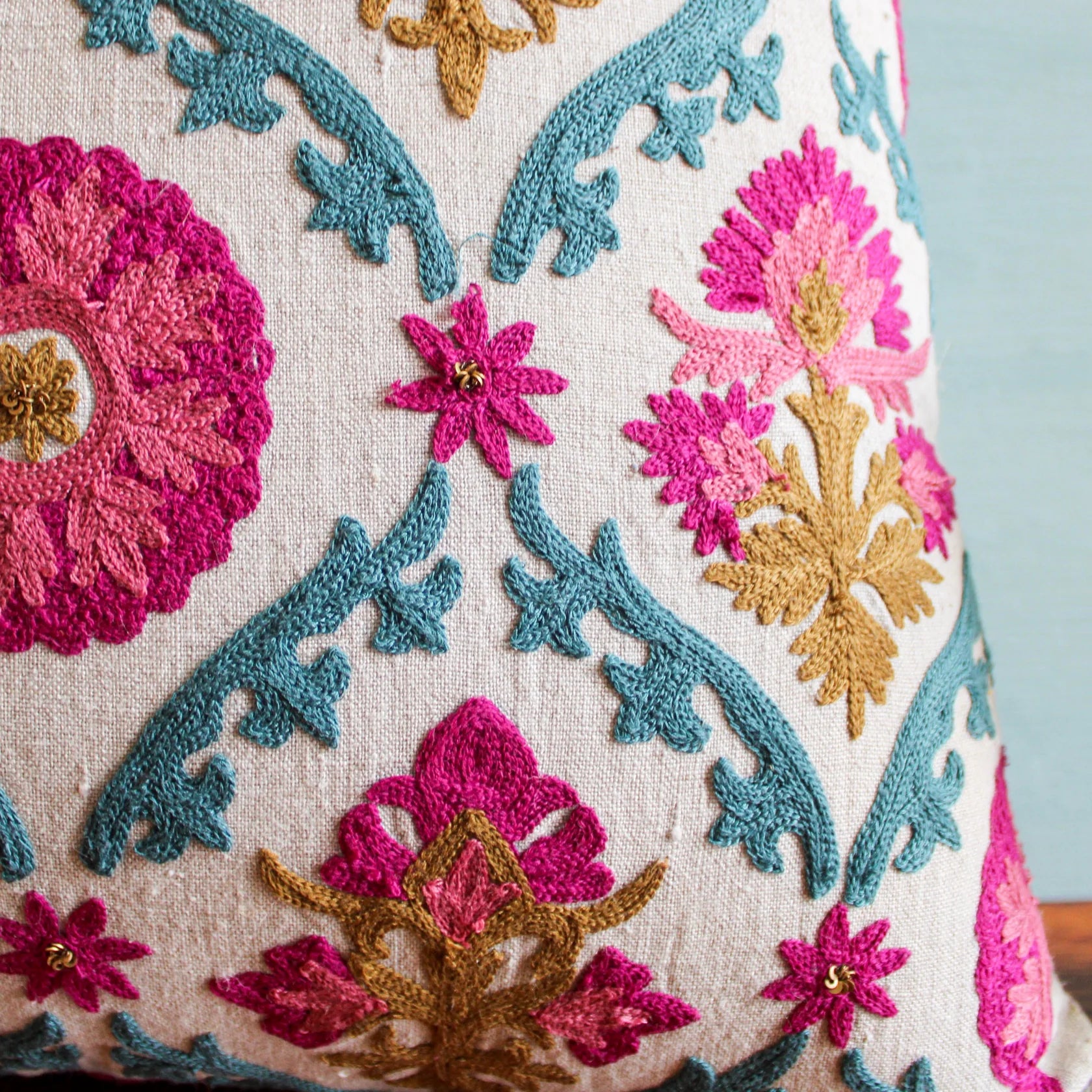 Suzani Farkhand linen cushion with floral trellis in pink, teal and mustard, 45 x 45cm