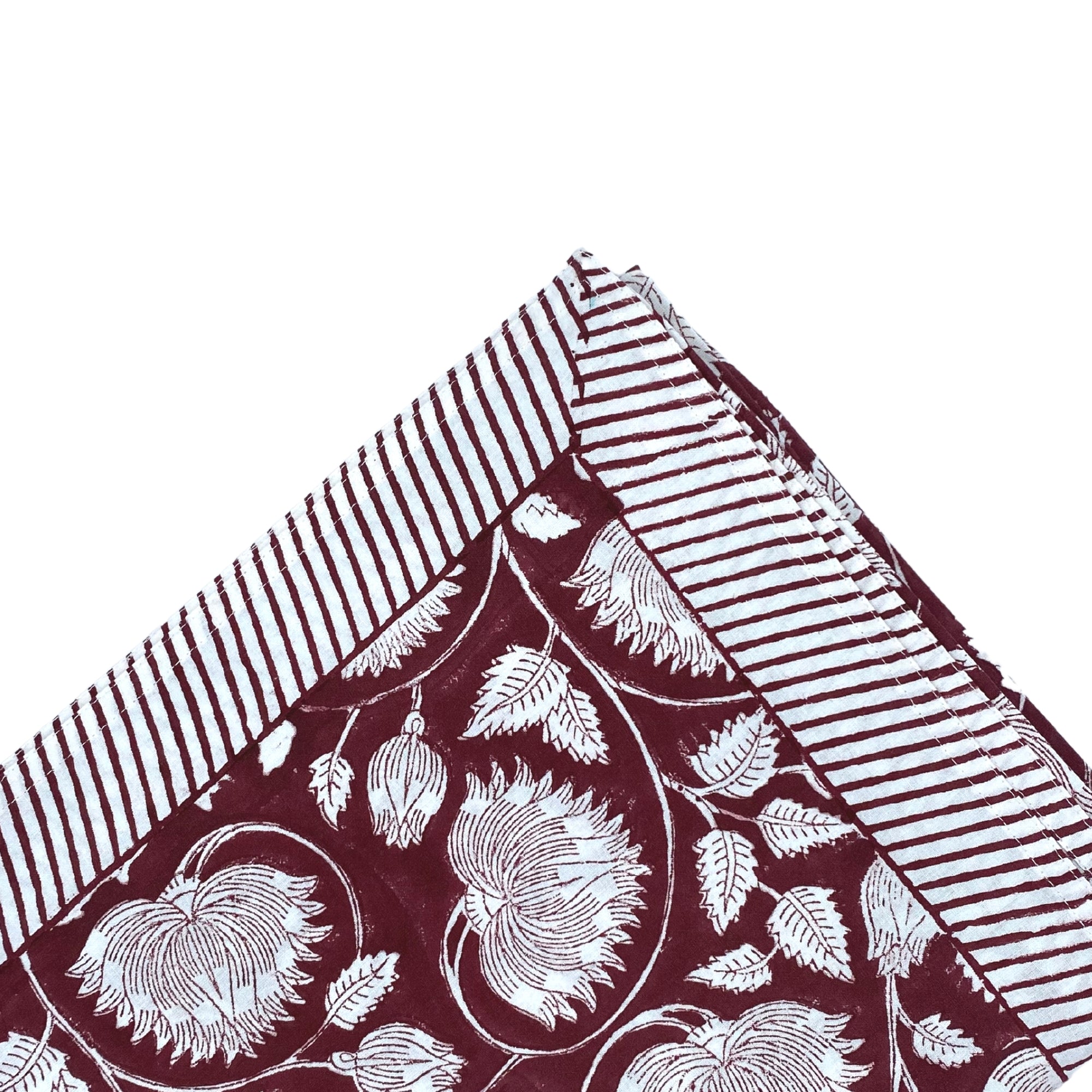 Lotus block-print tablecloth in burgundy cotton, detail of the all-over lotus print