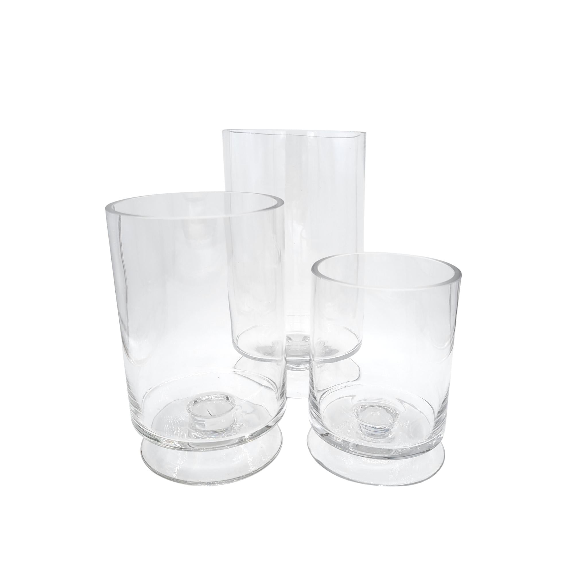 Set of three glass hurricane candle lamps in small, medium and large sizes