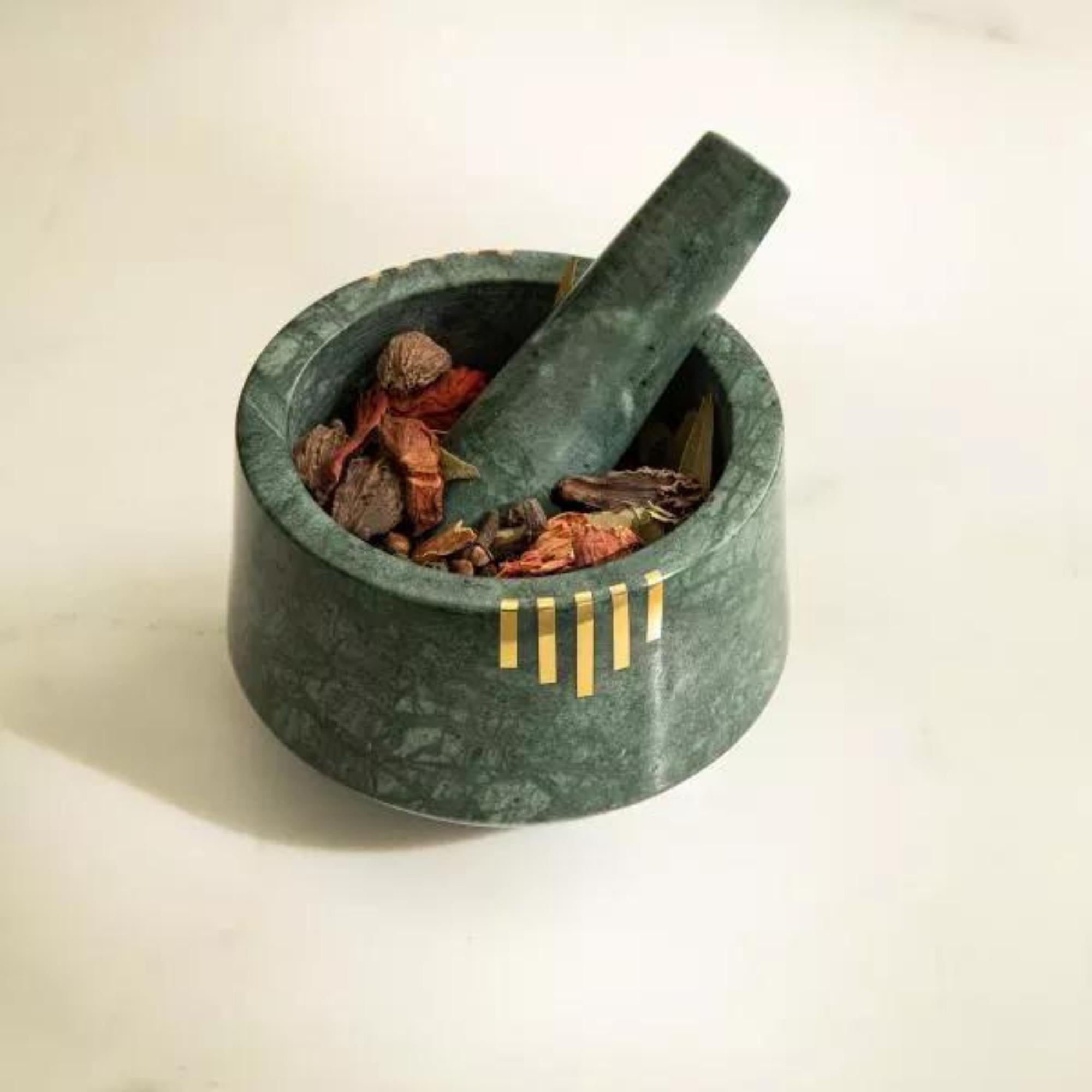Green marble mortar and pestle, brass inlay detail