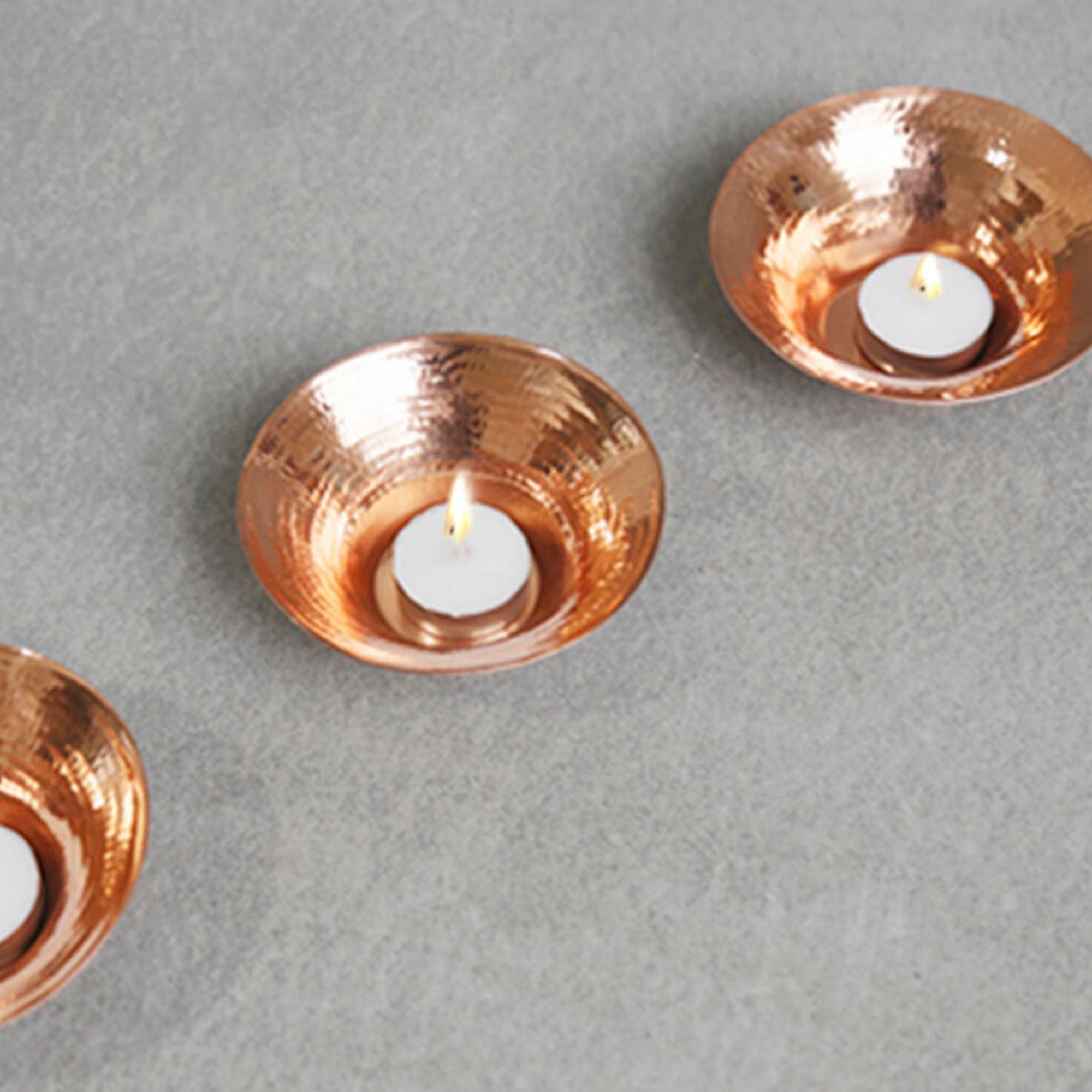 Hand-beaten copper Glimmer tea light holder, 12 x 4.5 cm, handmade in India