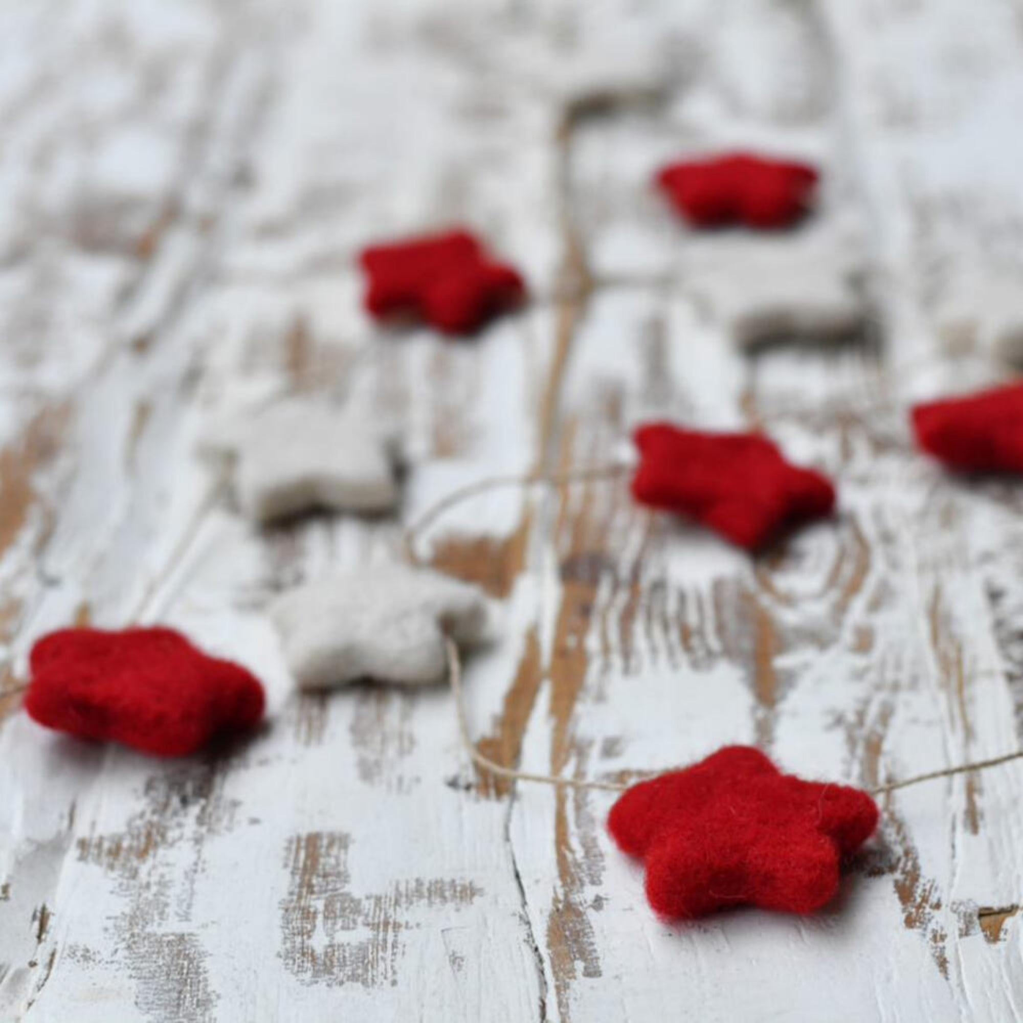 Red and white felt star garland, handwoven, India, detail