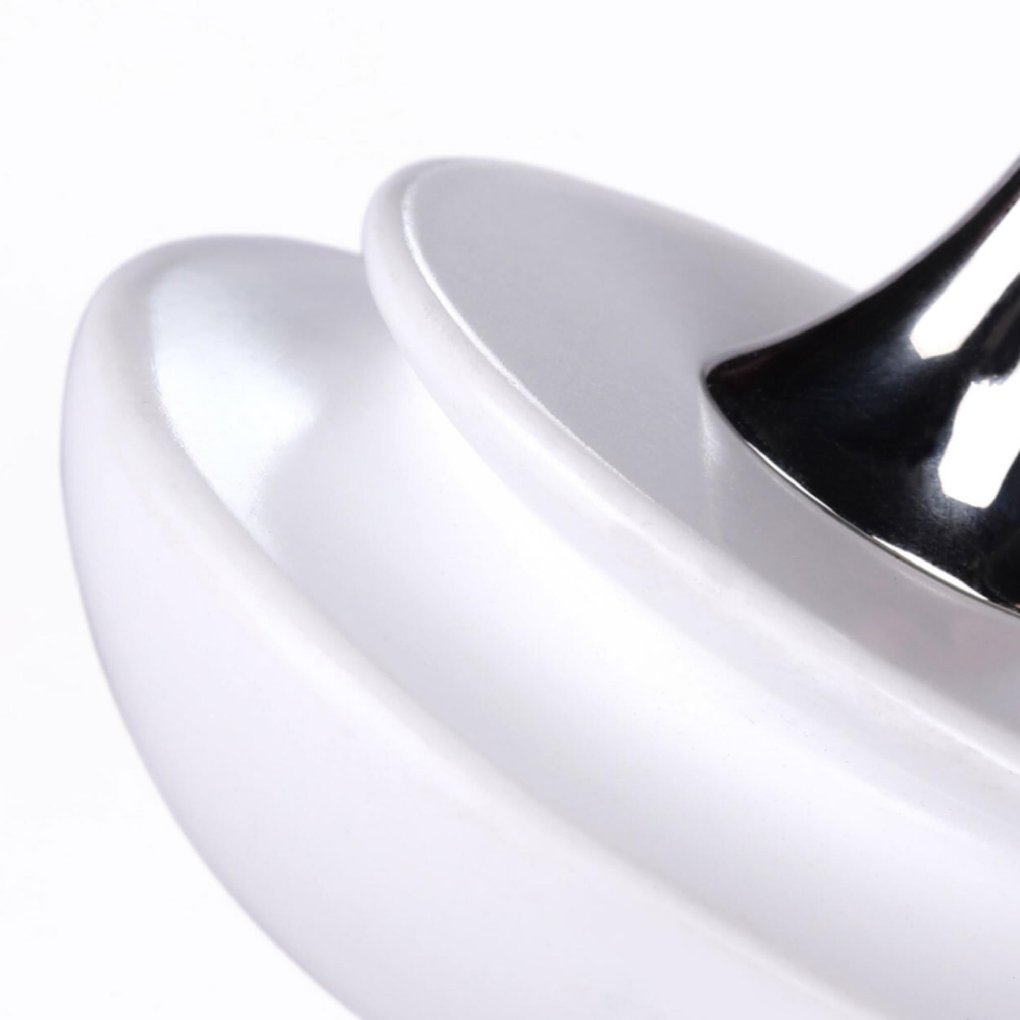 Tip-Top white spinning top, wood and stainless steel, side view