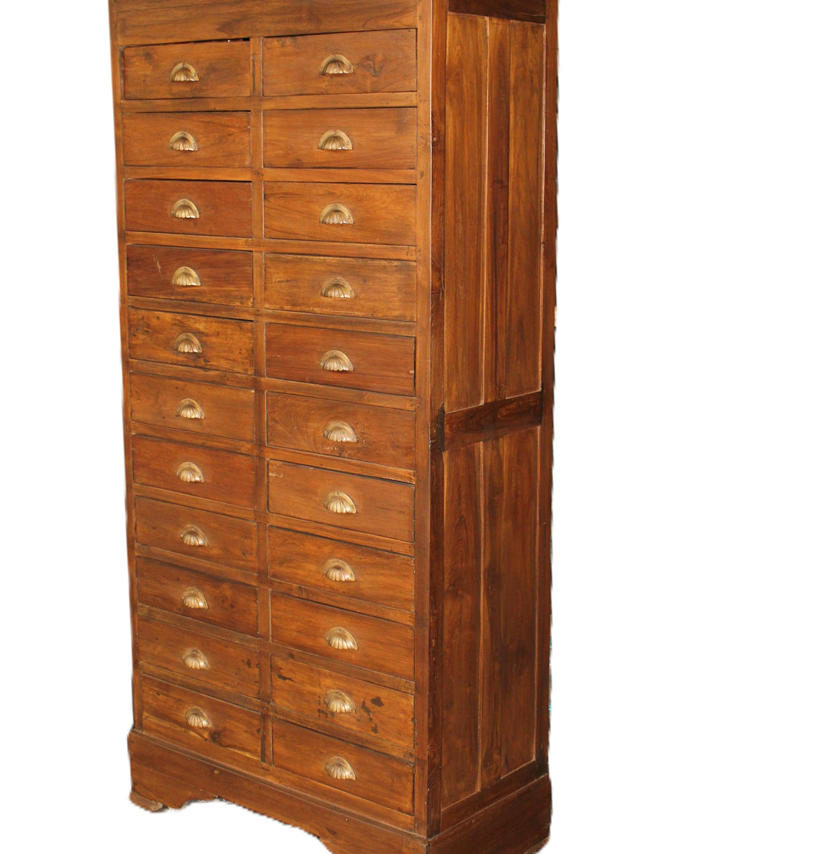 Teak chest of drawers with brass handles and a natural wax finish, standing 180 cm high, made in India