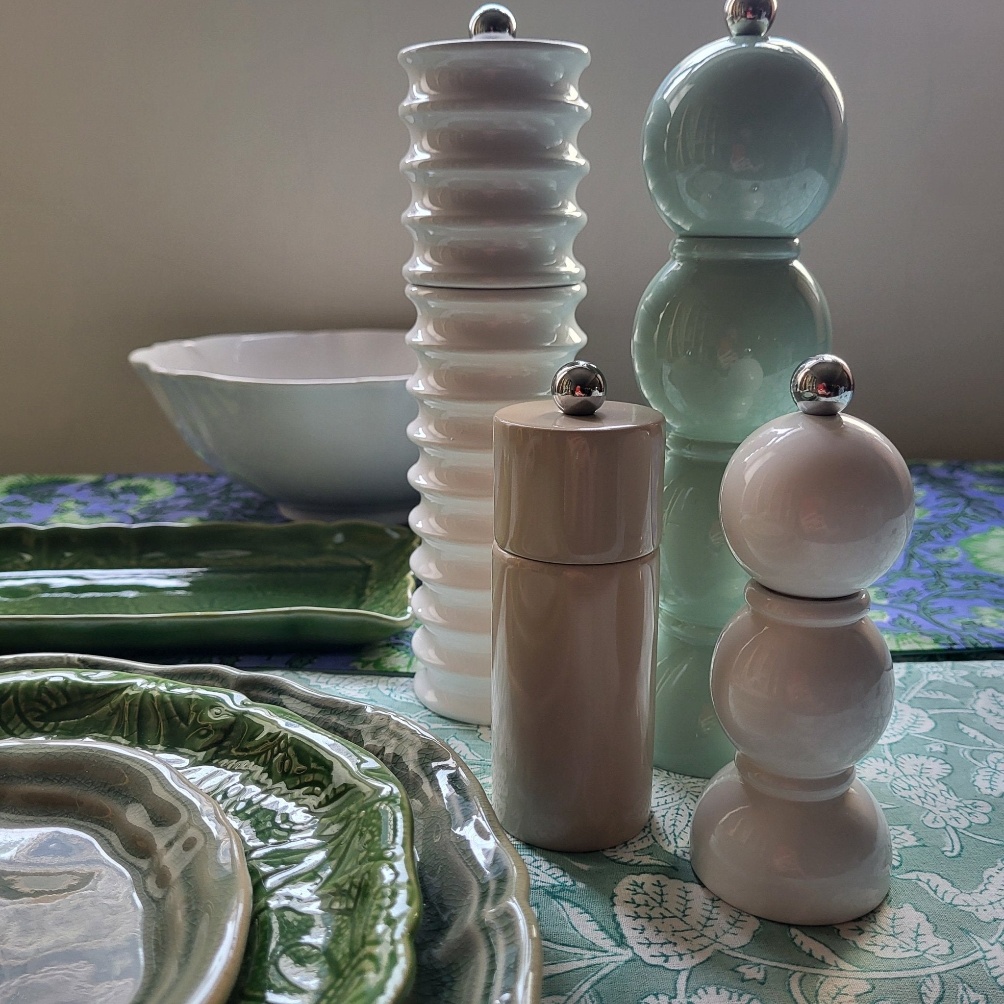 Group of bobbin salt and pepper mills in assorted lacquers