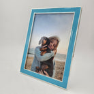 Blue enamel frame by Addison Ross, styled with photo in a home setting