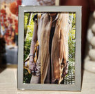 Chiffon enamel frame by Addison Ross, silver plate with grey velvet back, styled with photo