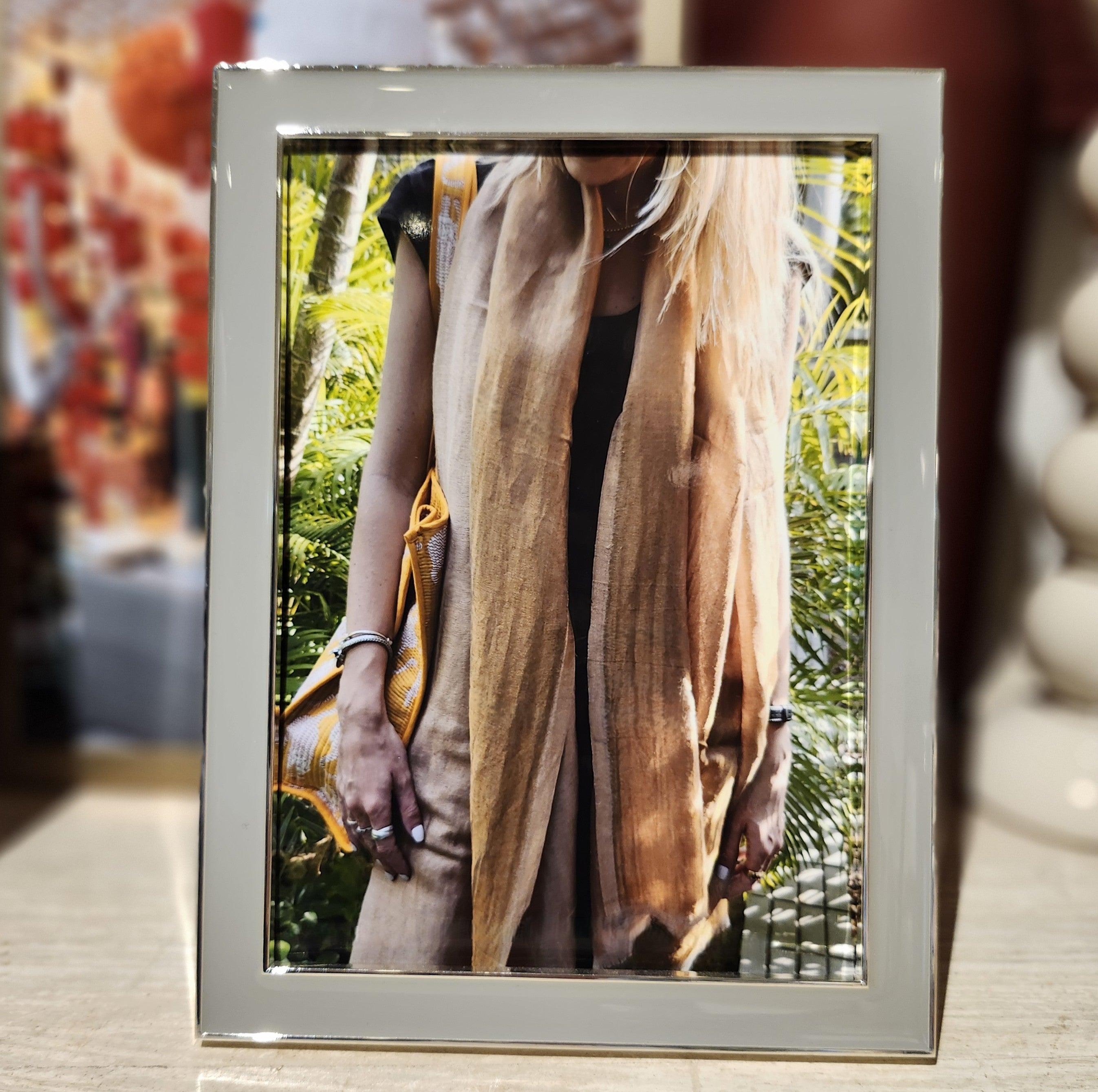 Chiffon enamel frame by Addison Ross, silver plate with grey velvet back, styled with photo