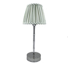 Silver bamboo lamp with a sage stripe shade